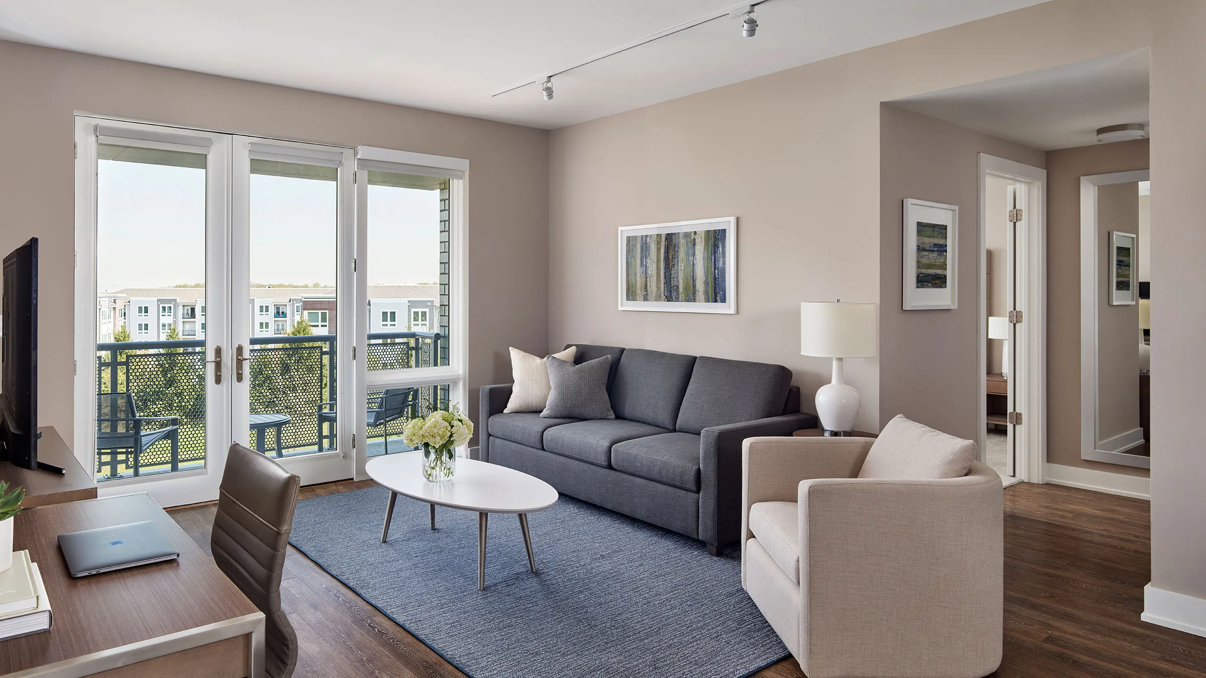 a living room with a couch and chairs