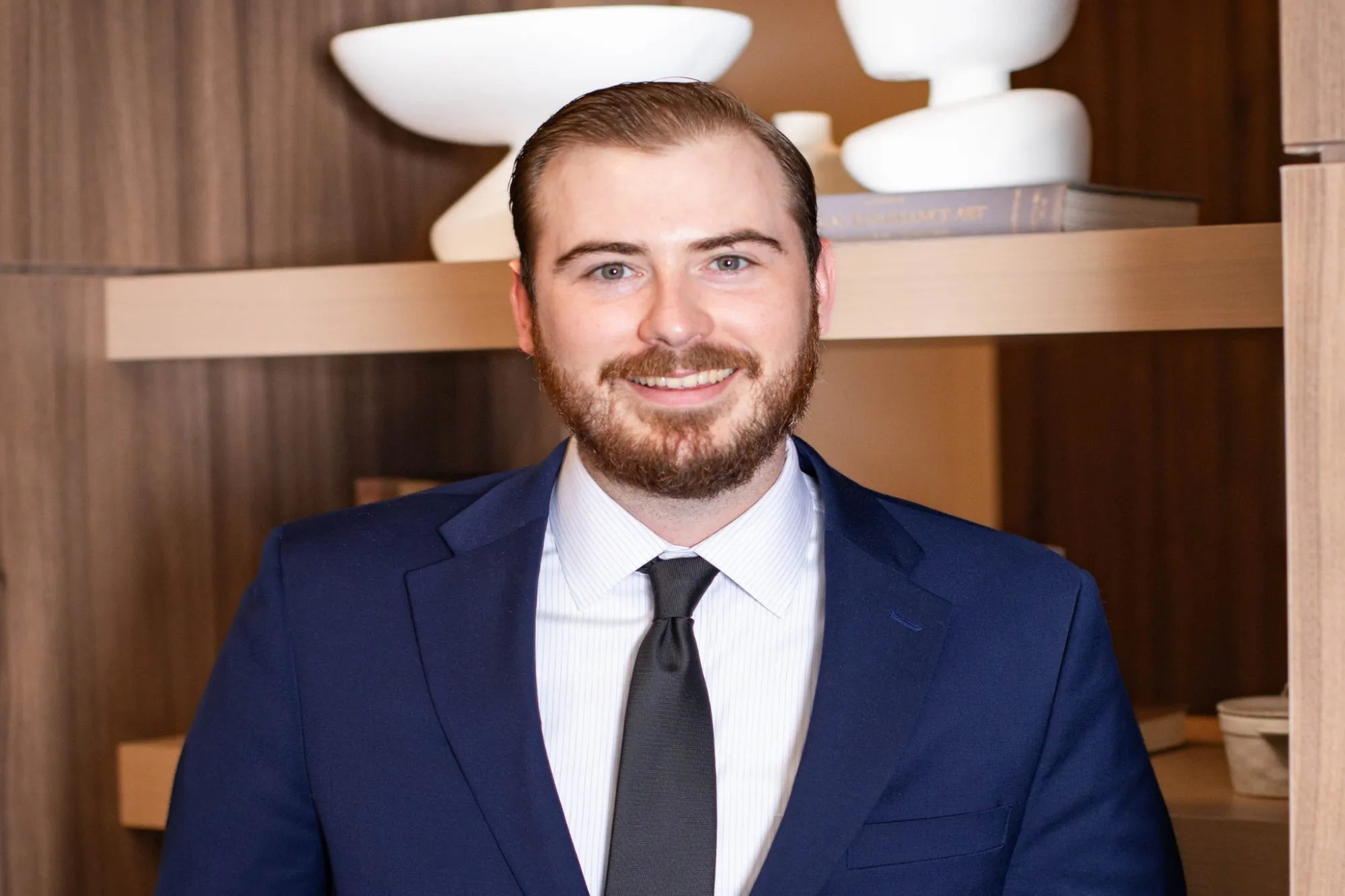 Headshot of a man in a blue suit 