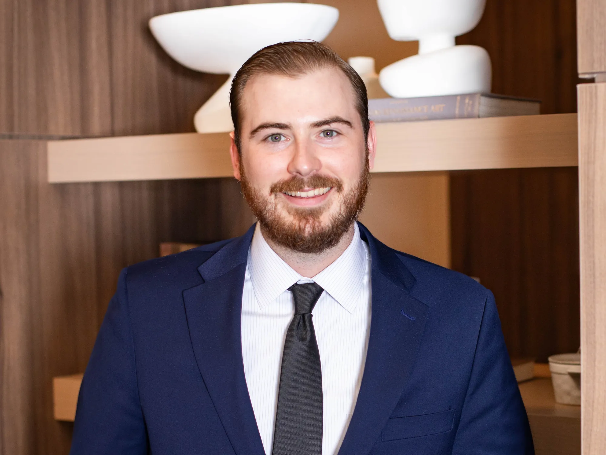 Headshot of a man in a blue suit 
