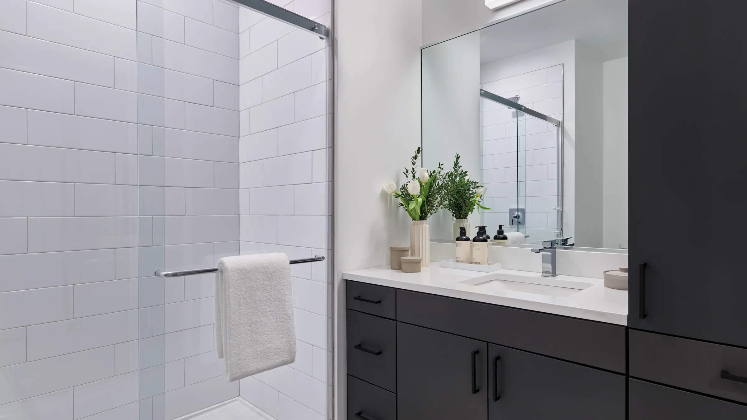 a bathroom with a shower and sink