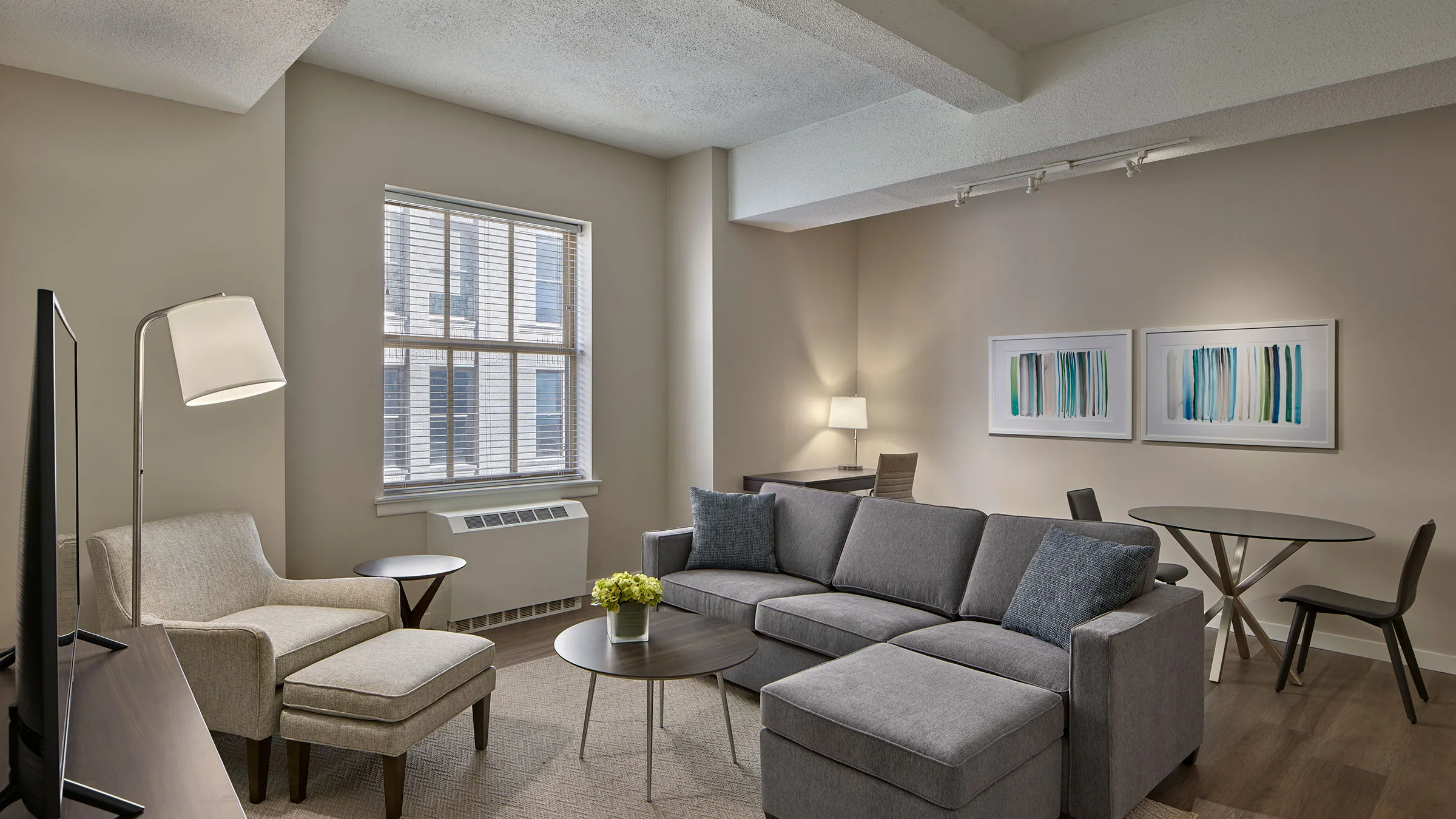 a living room with a couch and chairs