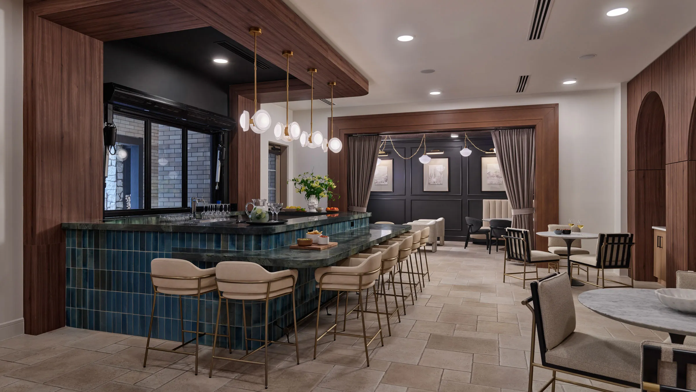 a bar with chairs in a room