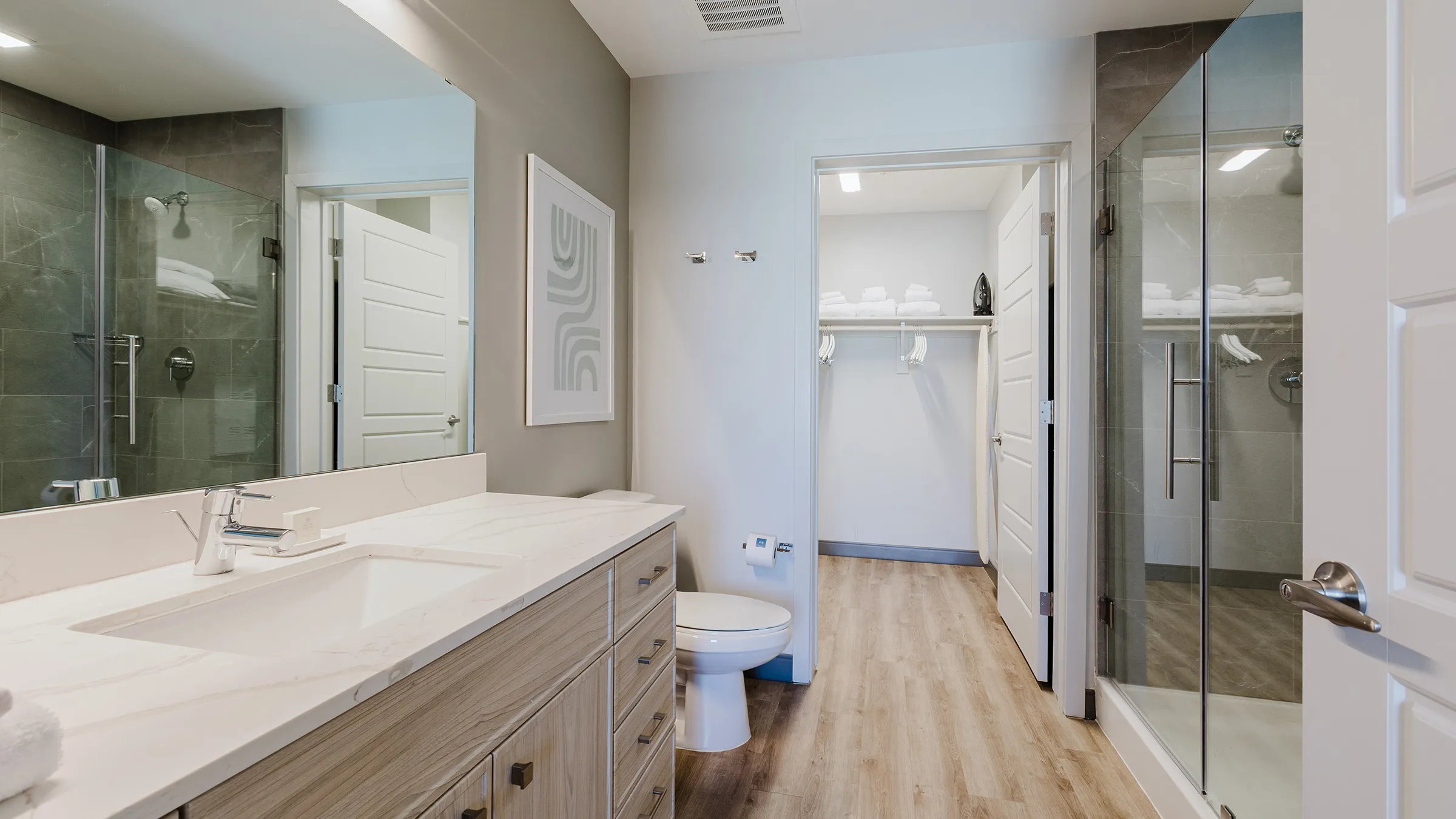 a bathroom with a shower and sink