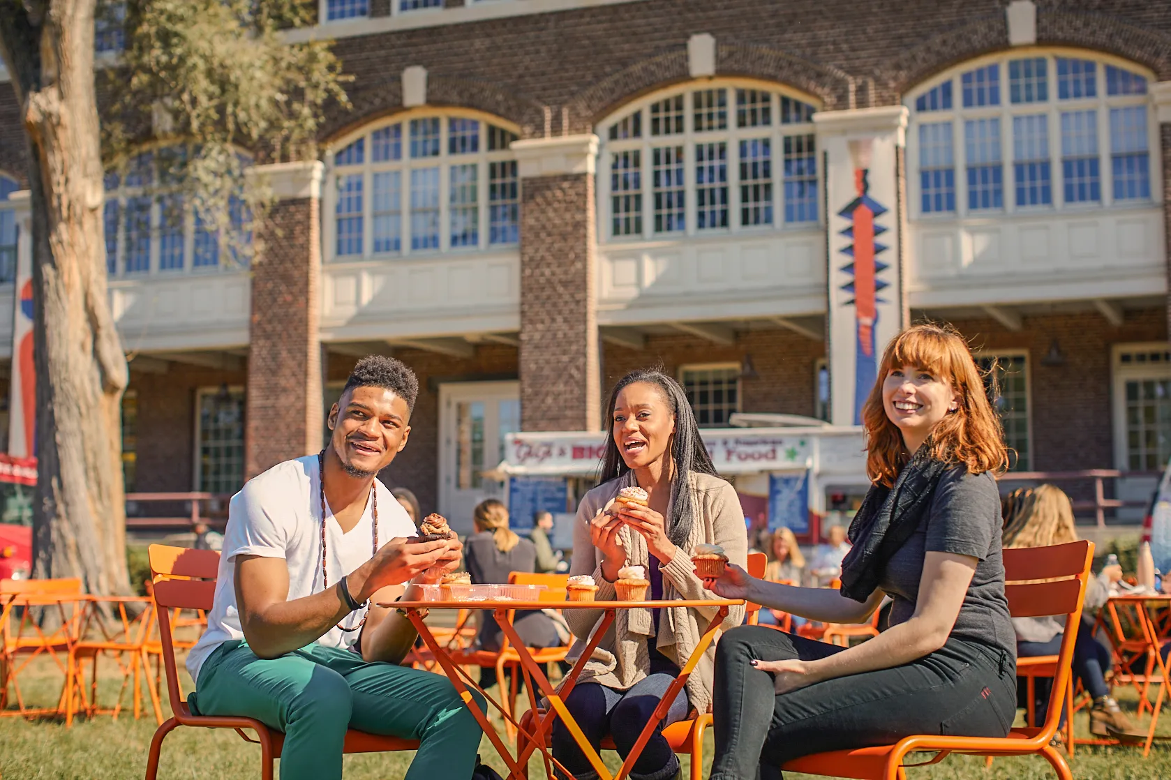 a group of people sitting at a table outside at the Navy Yard in Philadelphia, PA