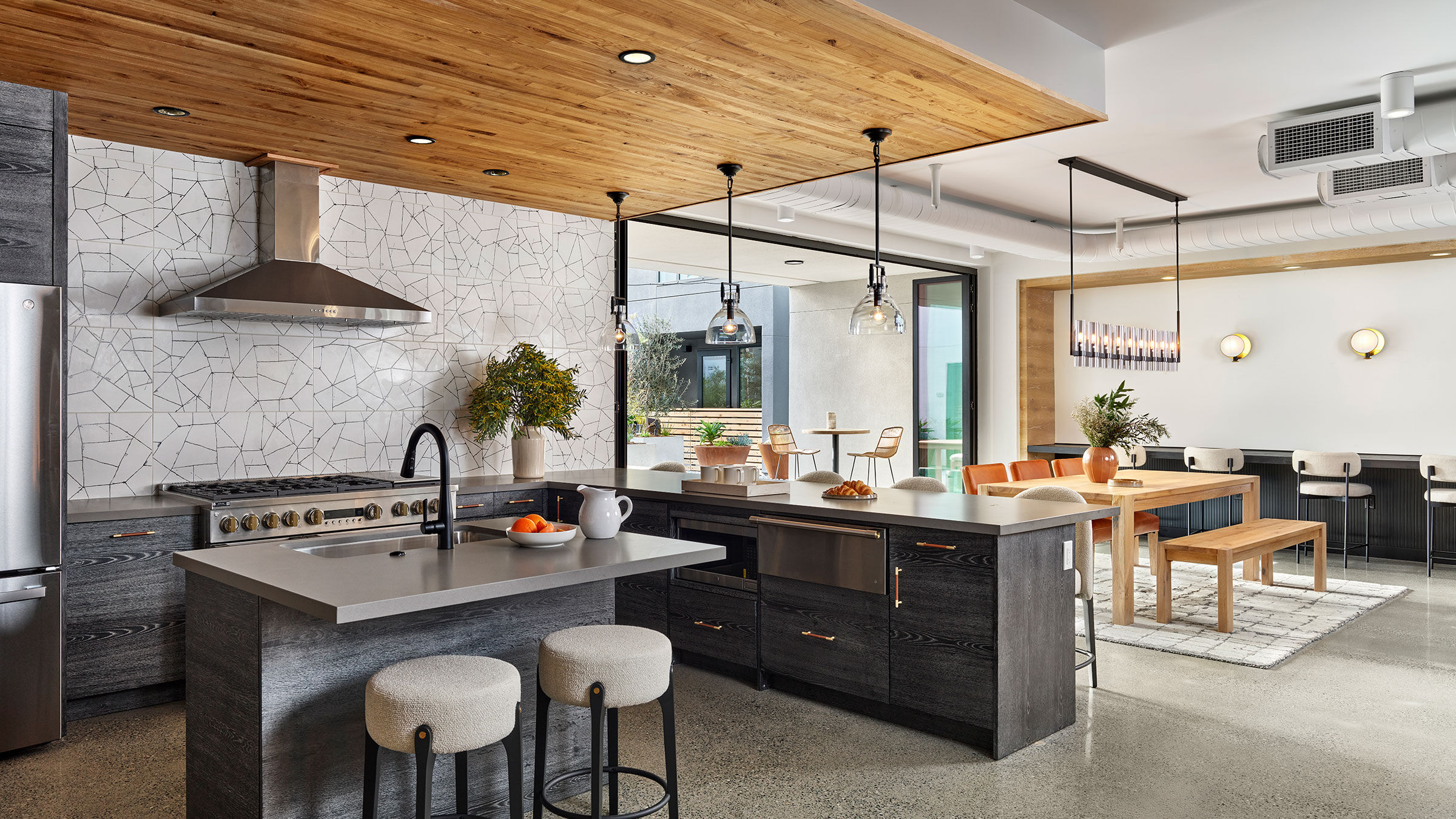 a kitchen with a large island and a dining table