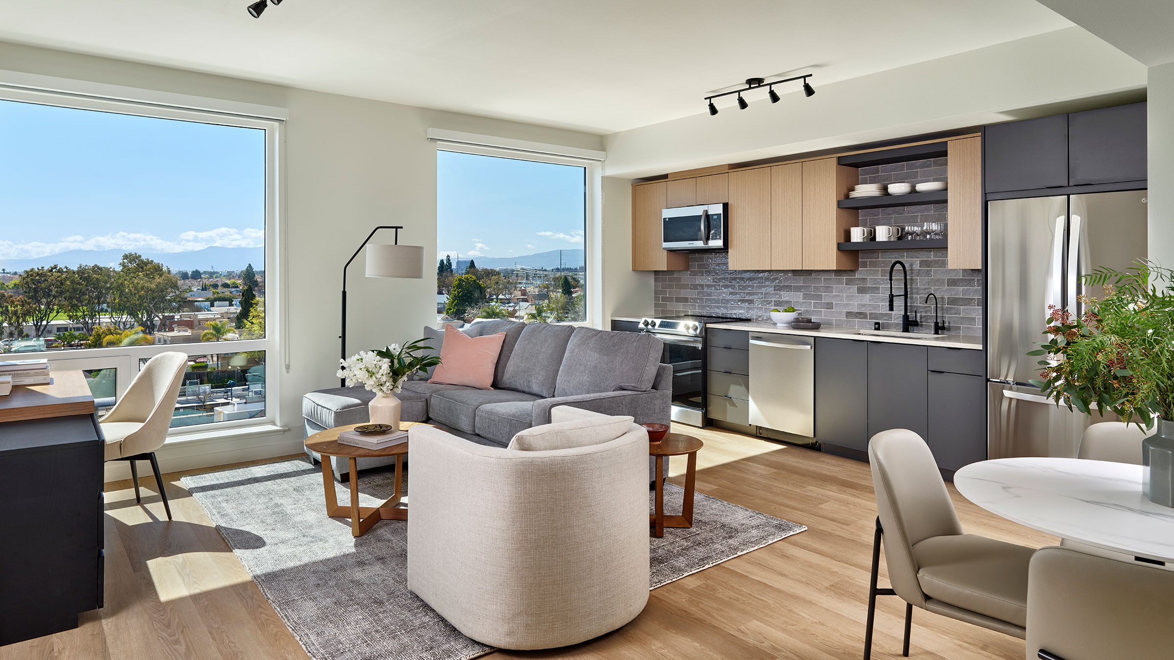 a living room with a couch and kitchen