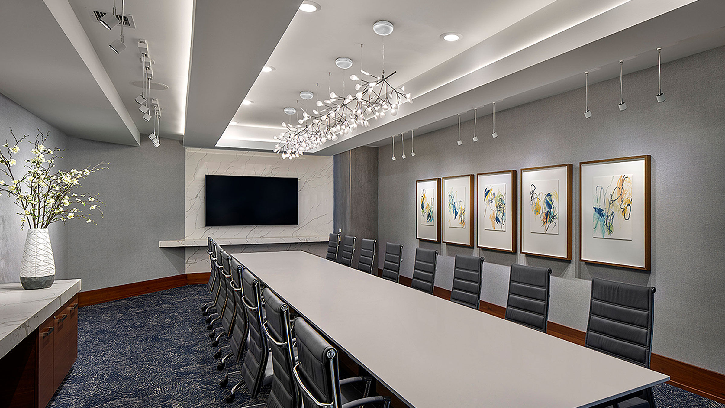 a conference room with a long table and chairs