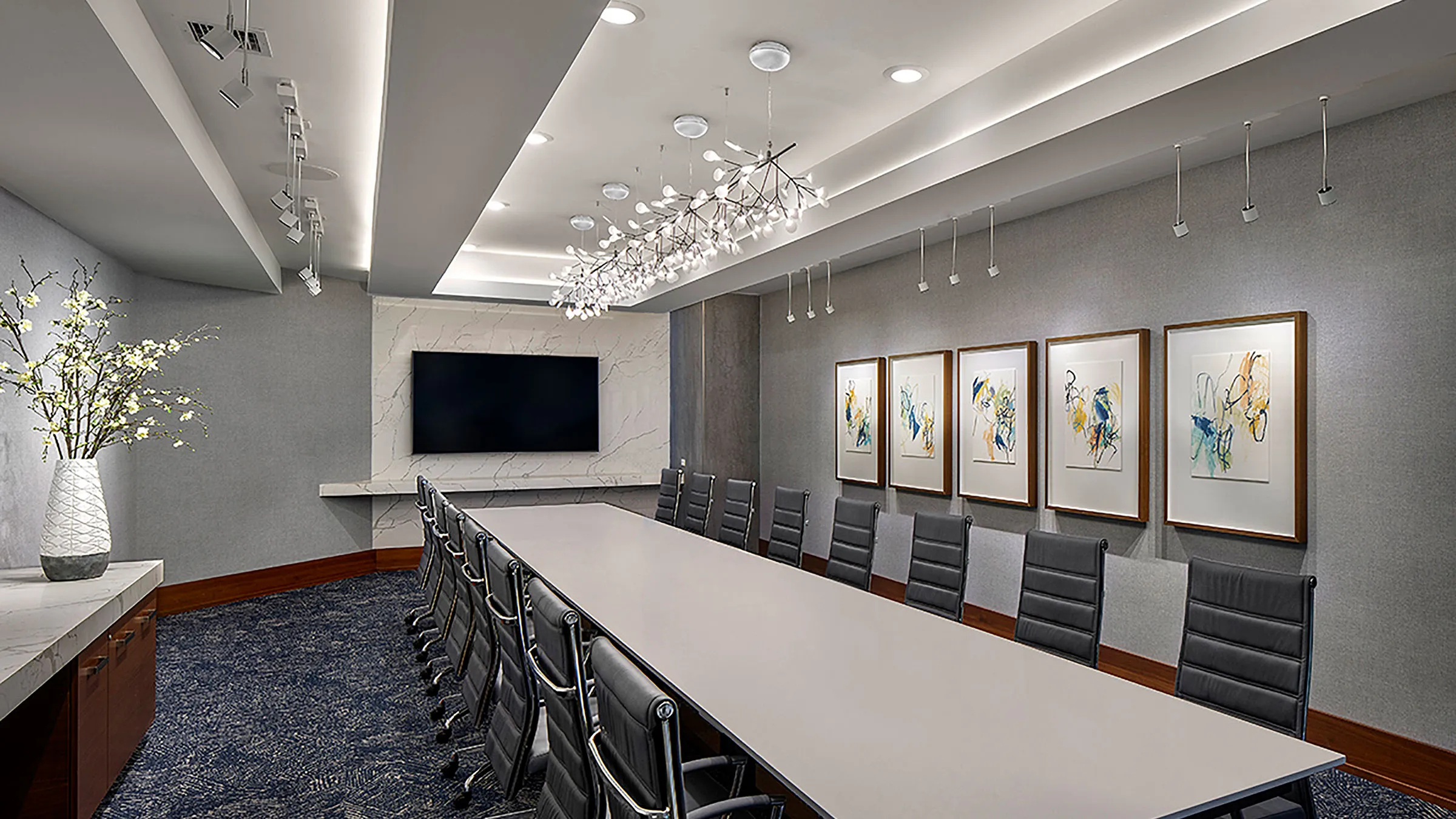 a conference room with a long table and chairs