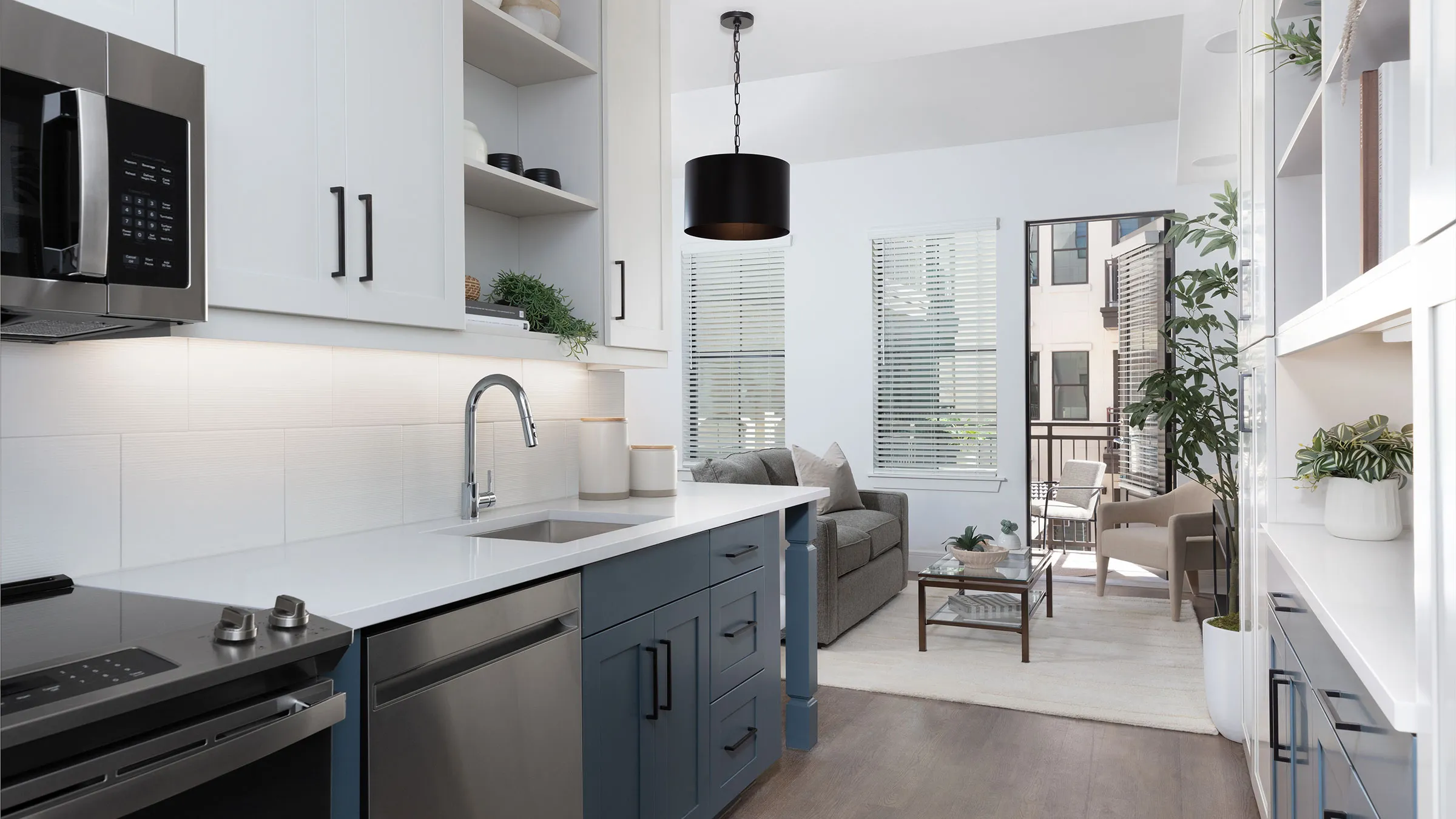 a kitchen with a sink and a couch