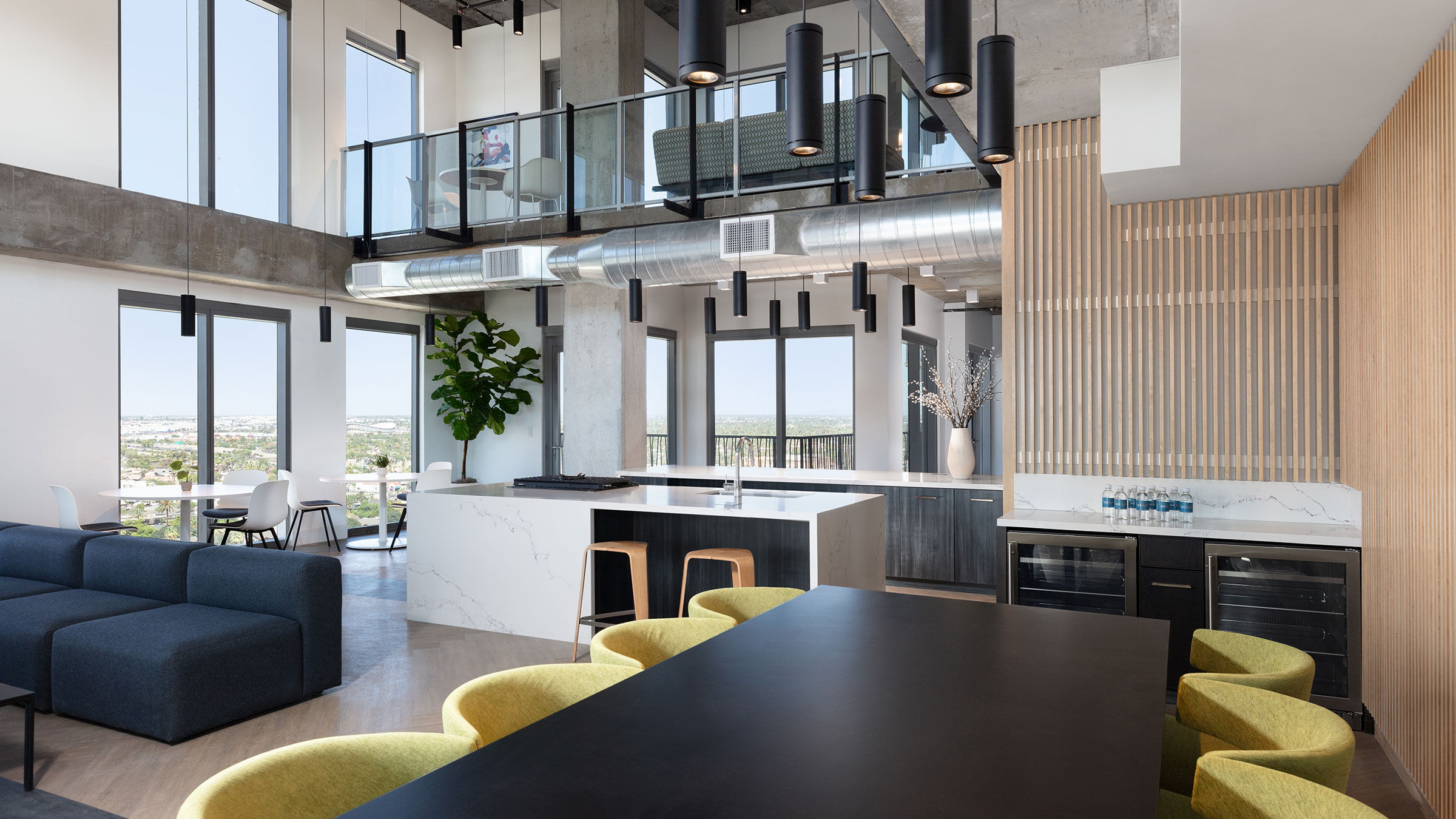 a room with a kitchen and dining area