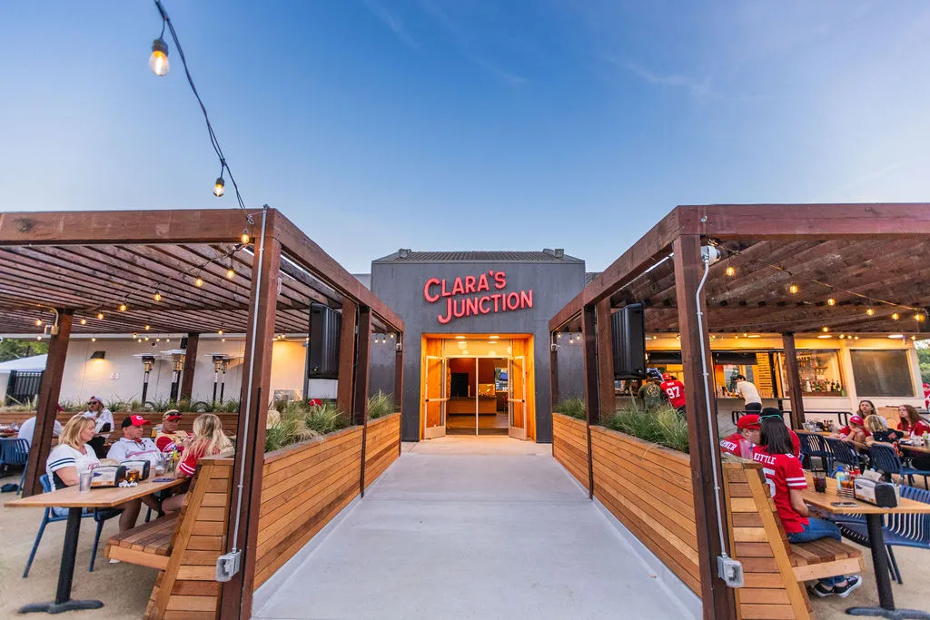 a building with a walkway and a sign