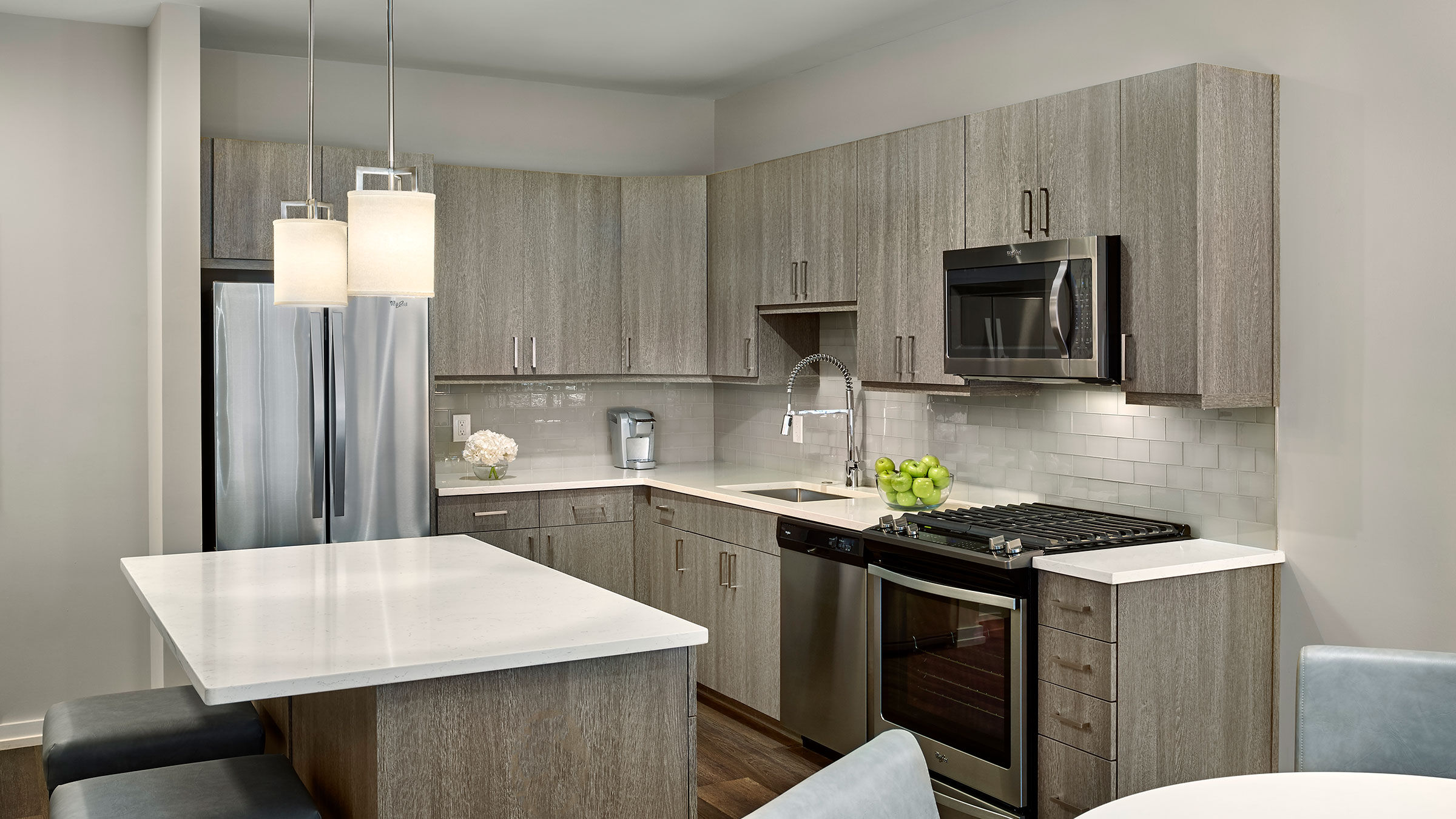 a kitchen with a white counter top and a white countertop
