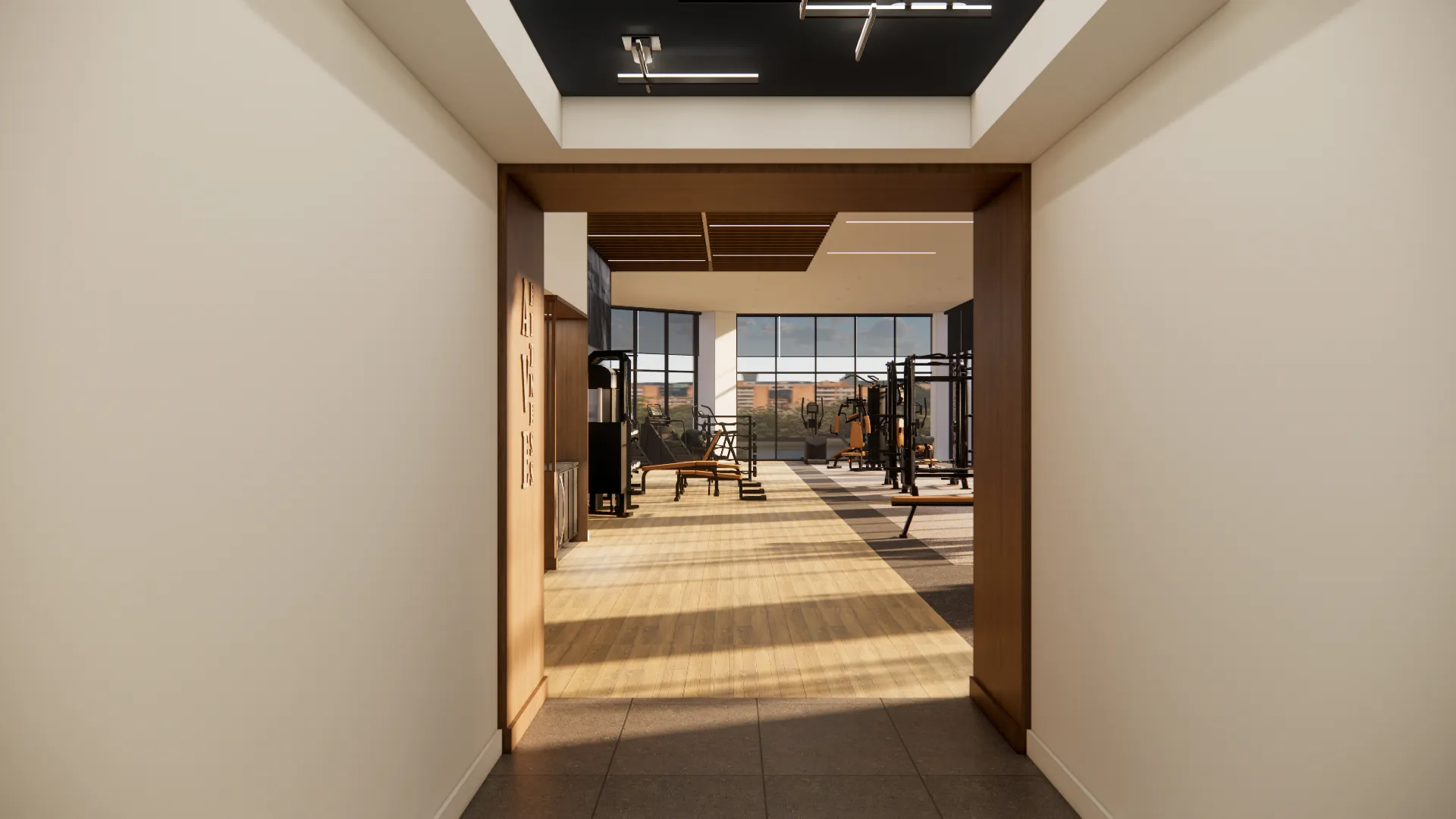 a gym with exercise equipment in the middle of the room