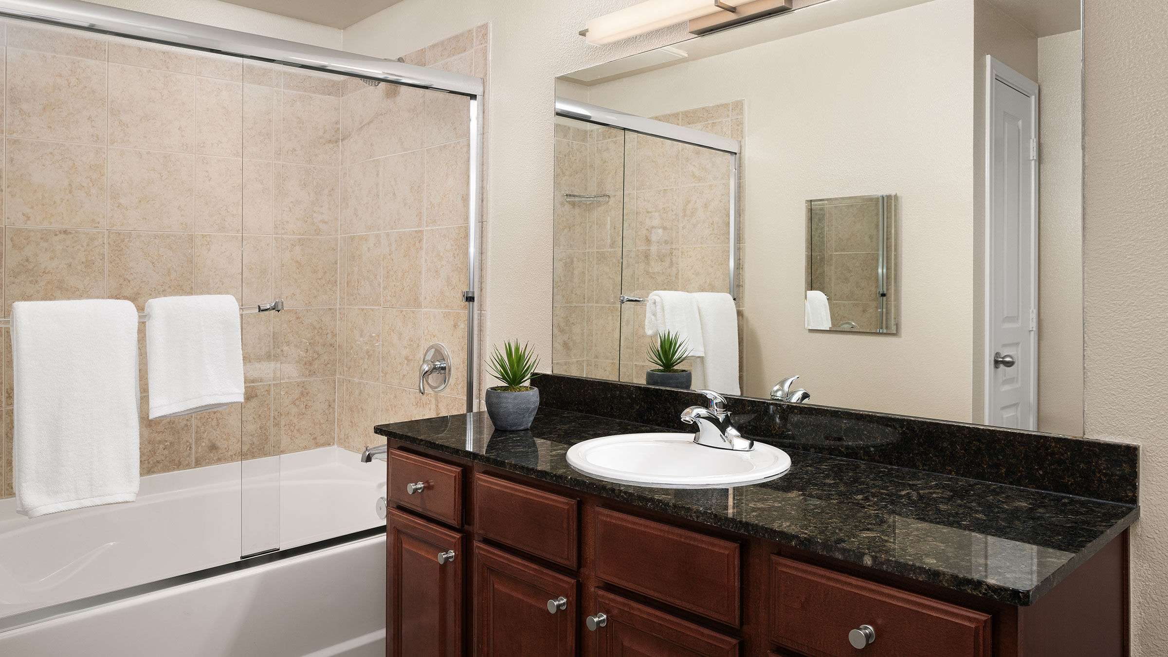 a bathroom with a sink and shower