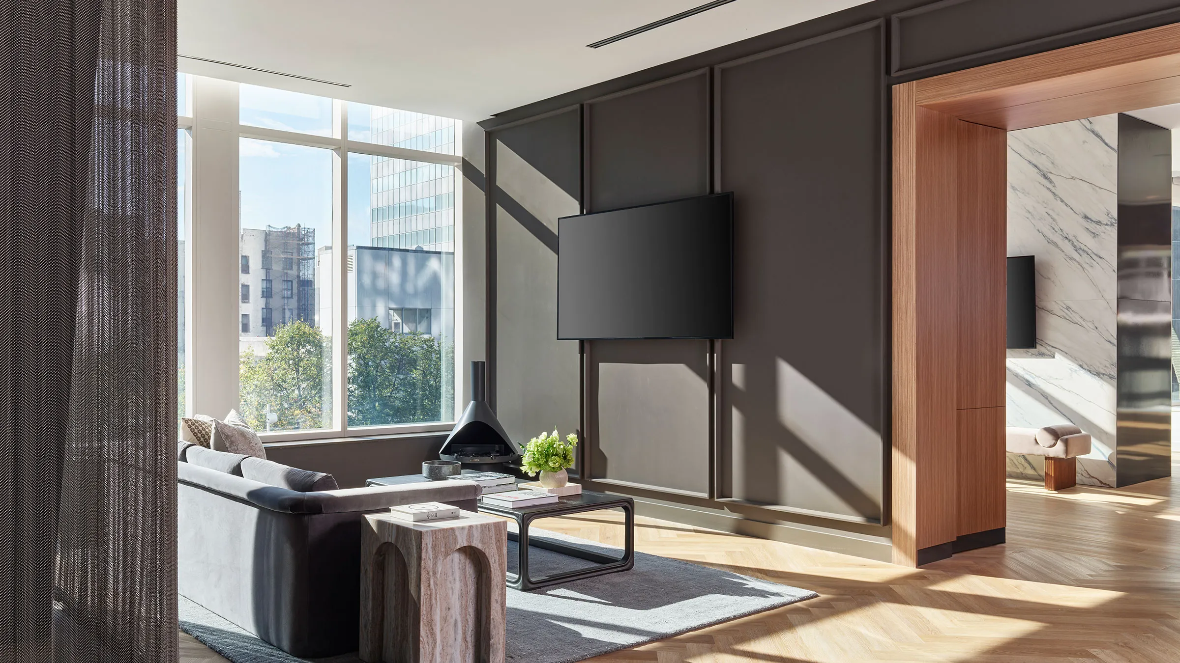 a living room with a television on the wall