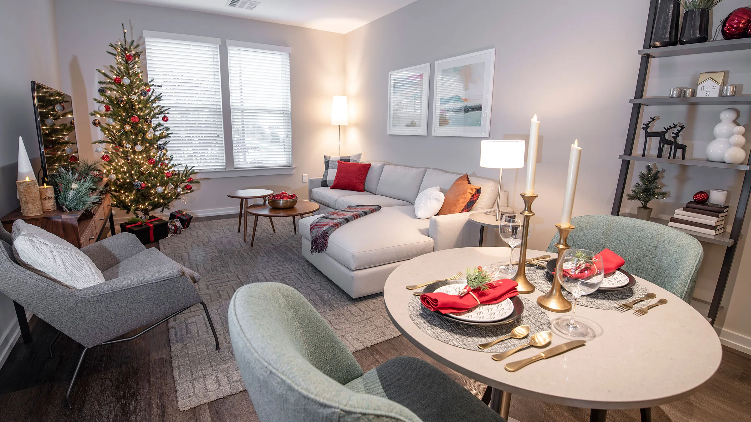 a living room with a christmas tree and a couch