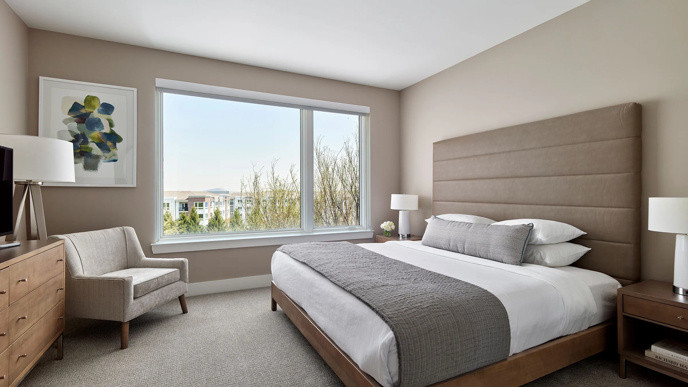 a bedroom with a large window