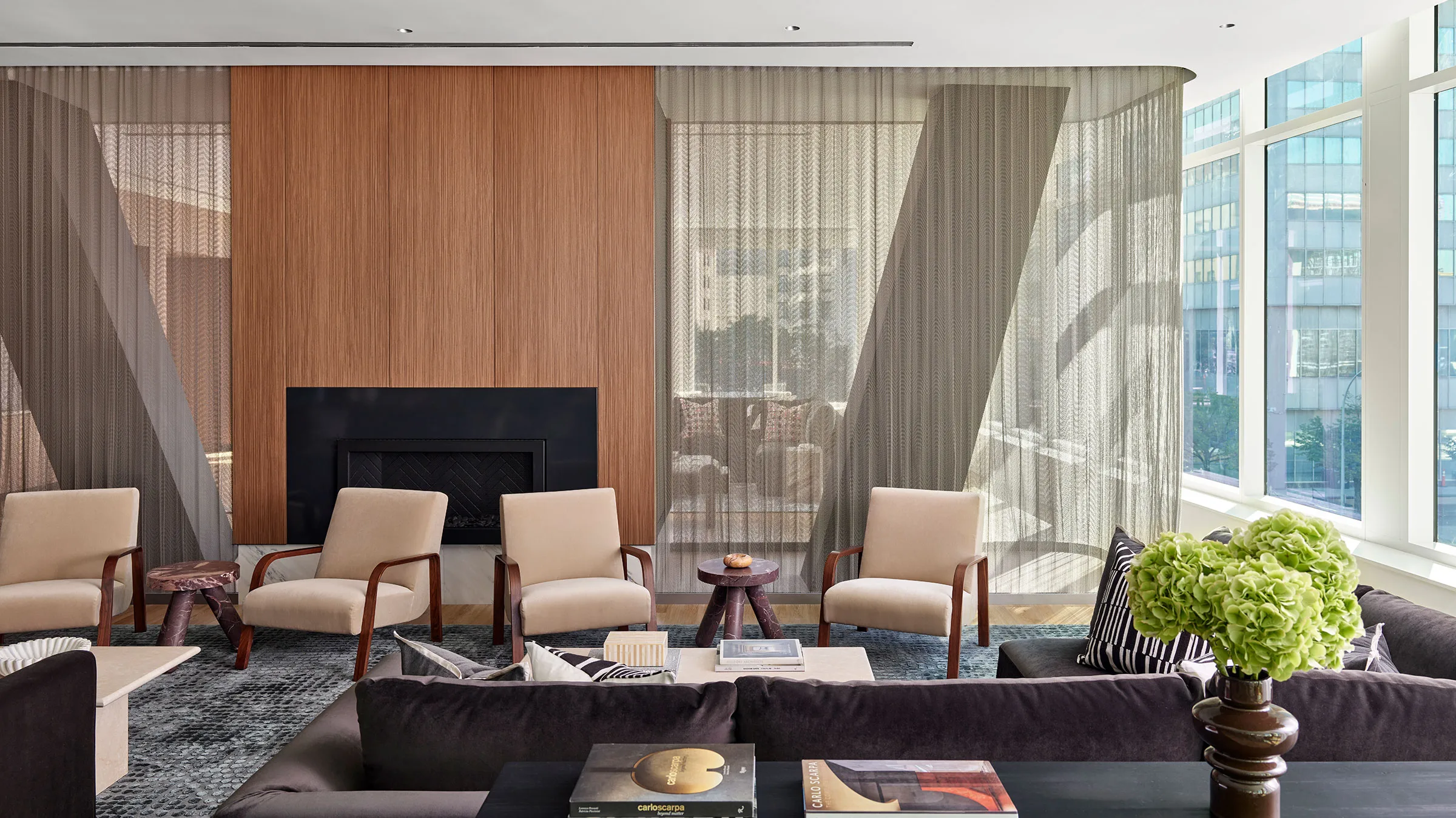 a room with a fireplace and chairs