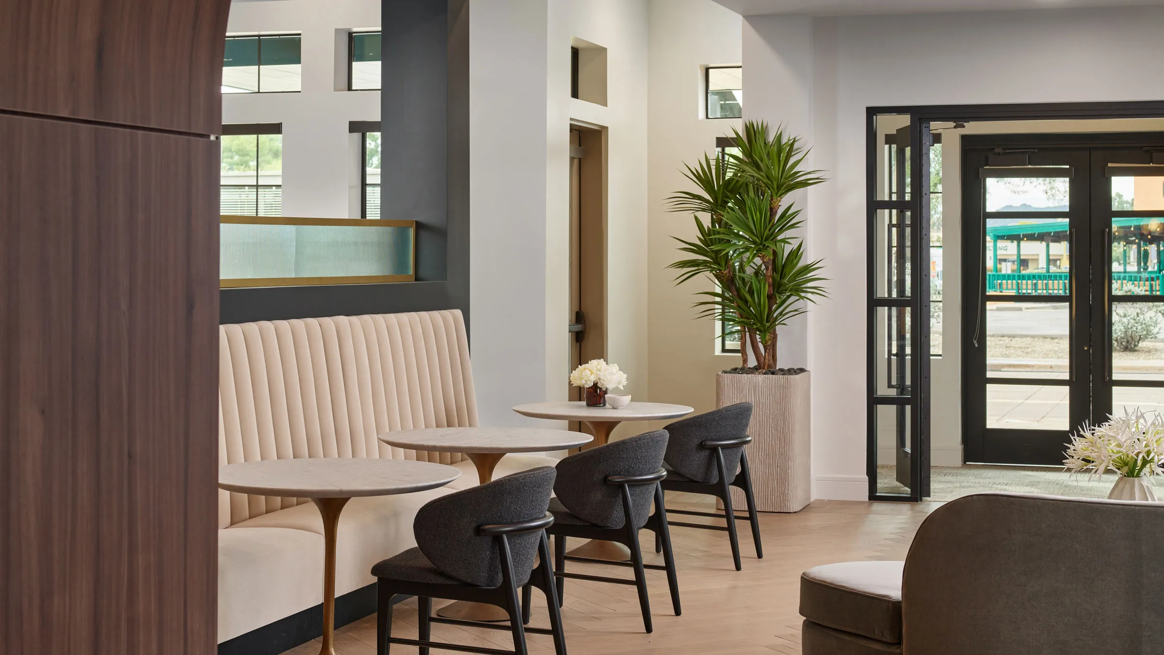 a room with a couch and tables