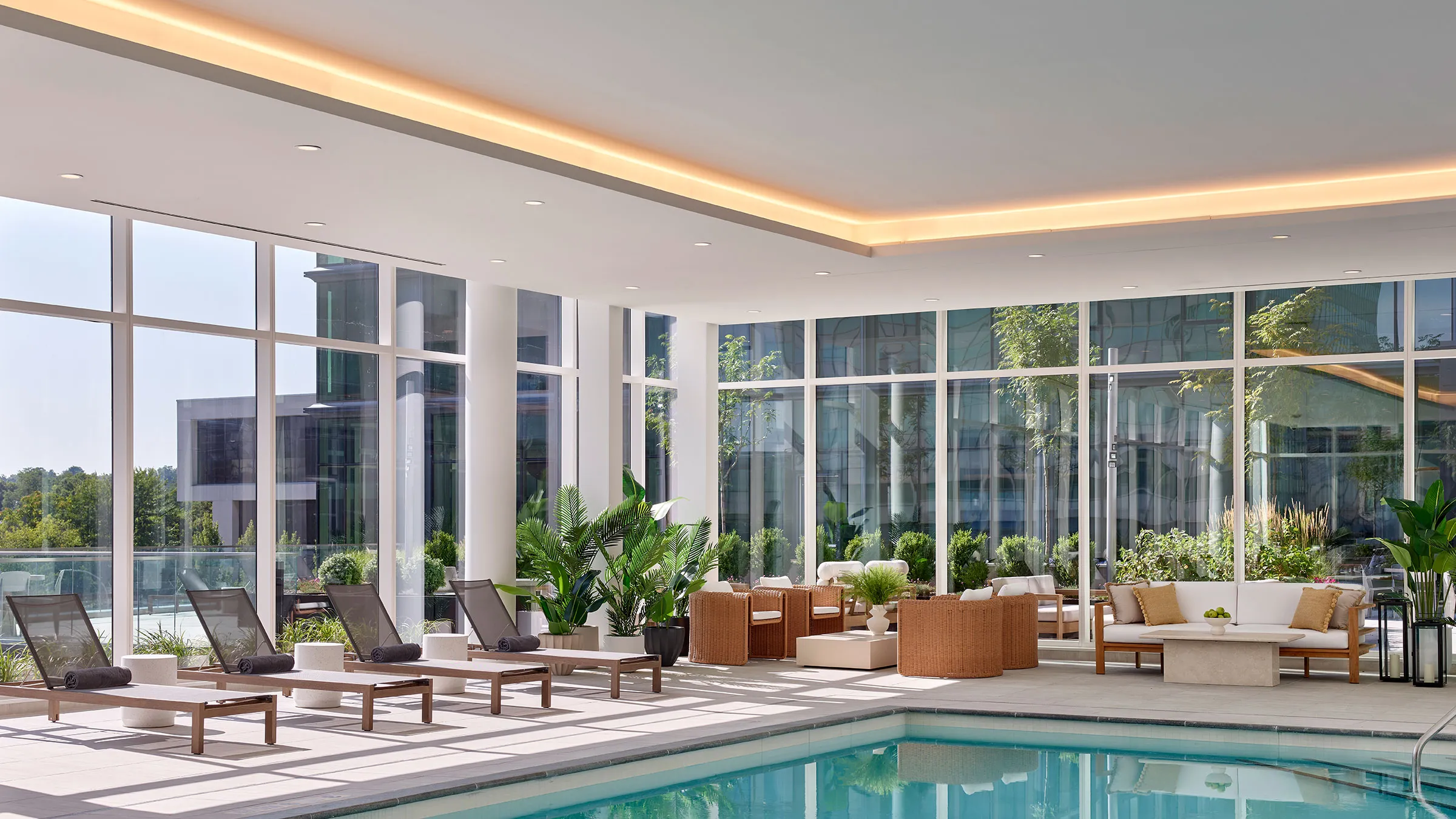 a swimming pool with chairs and chairs