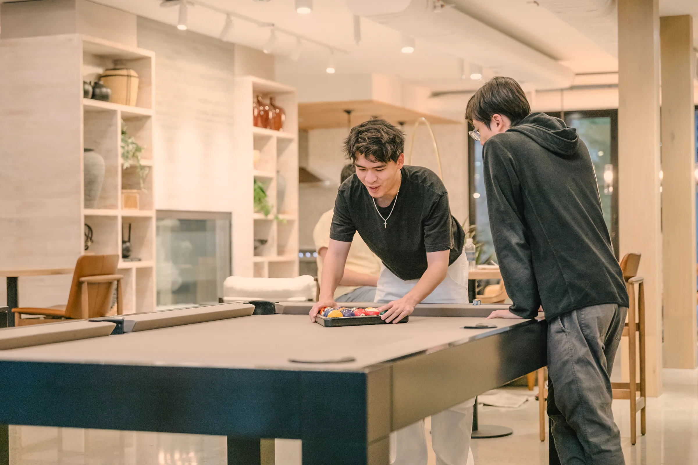 a group of men playing pool