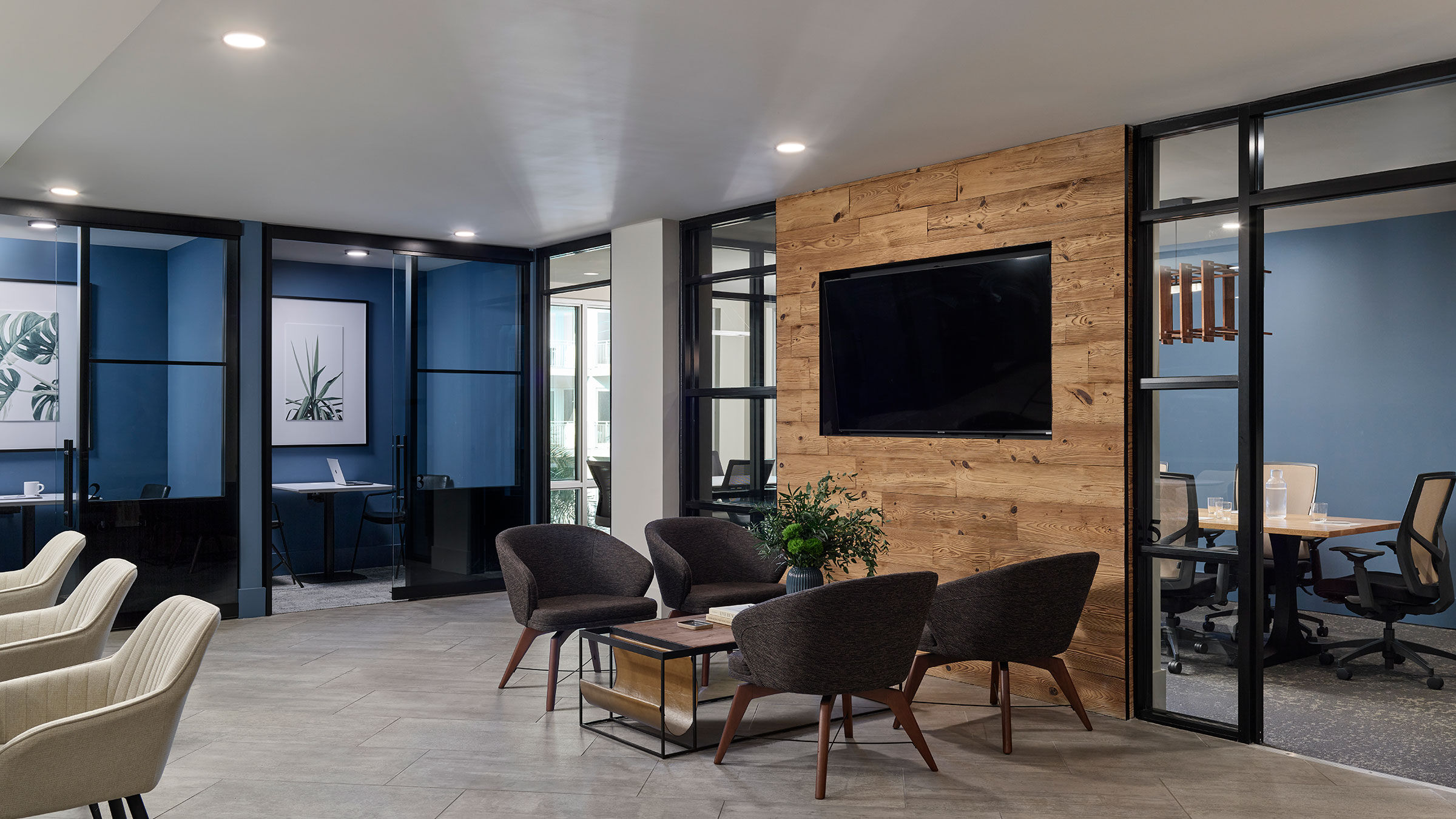 a room with a television and chairs