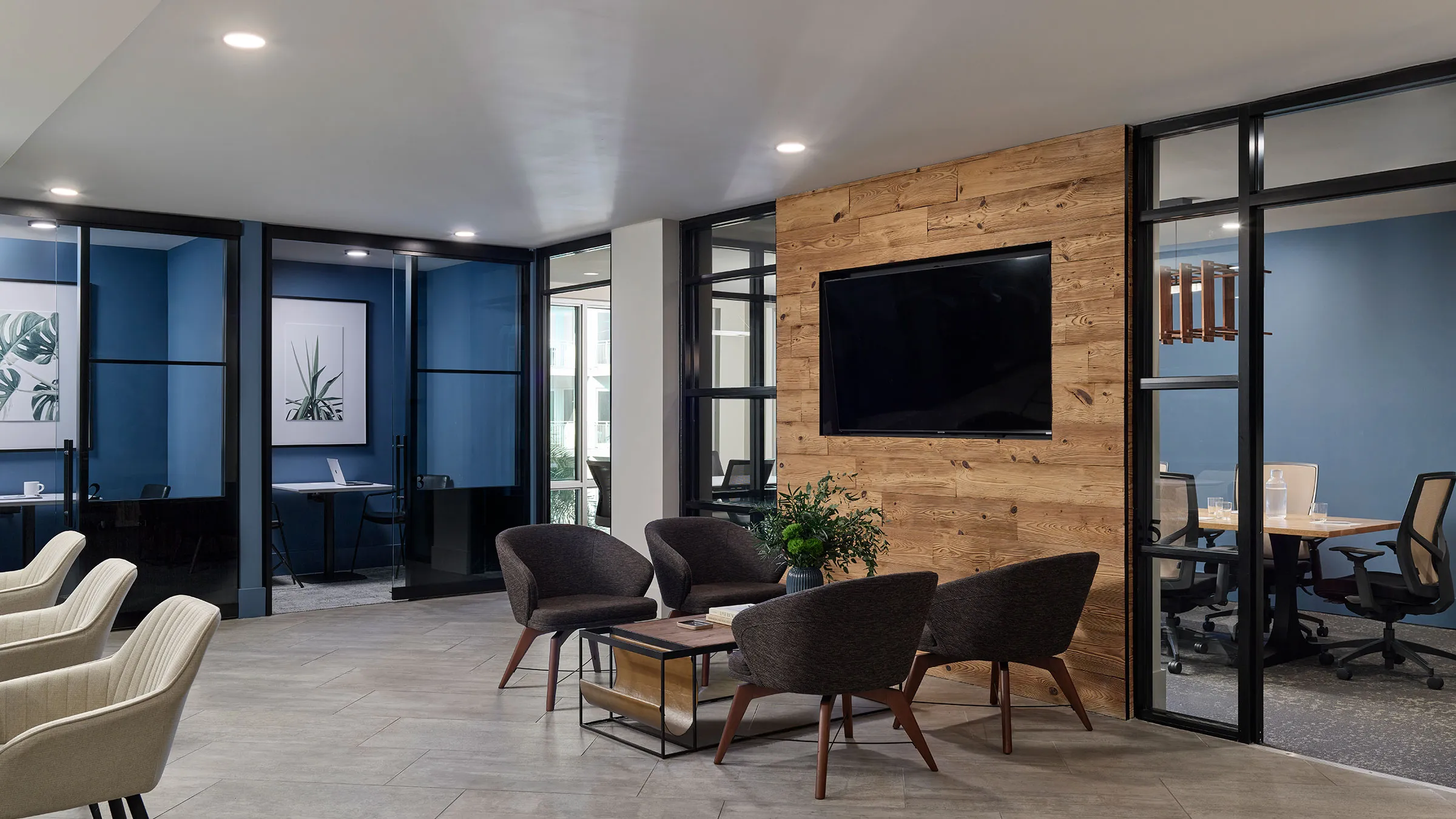 a room with a television and chairs