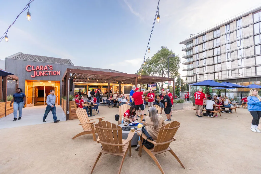 people sitting in chairs outside a building
