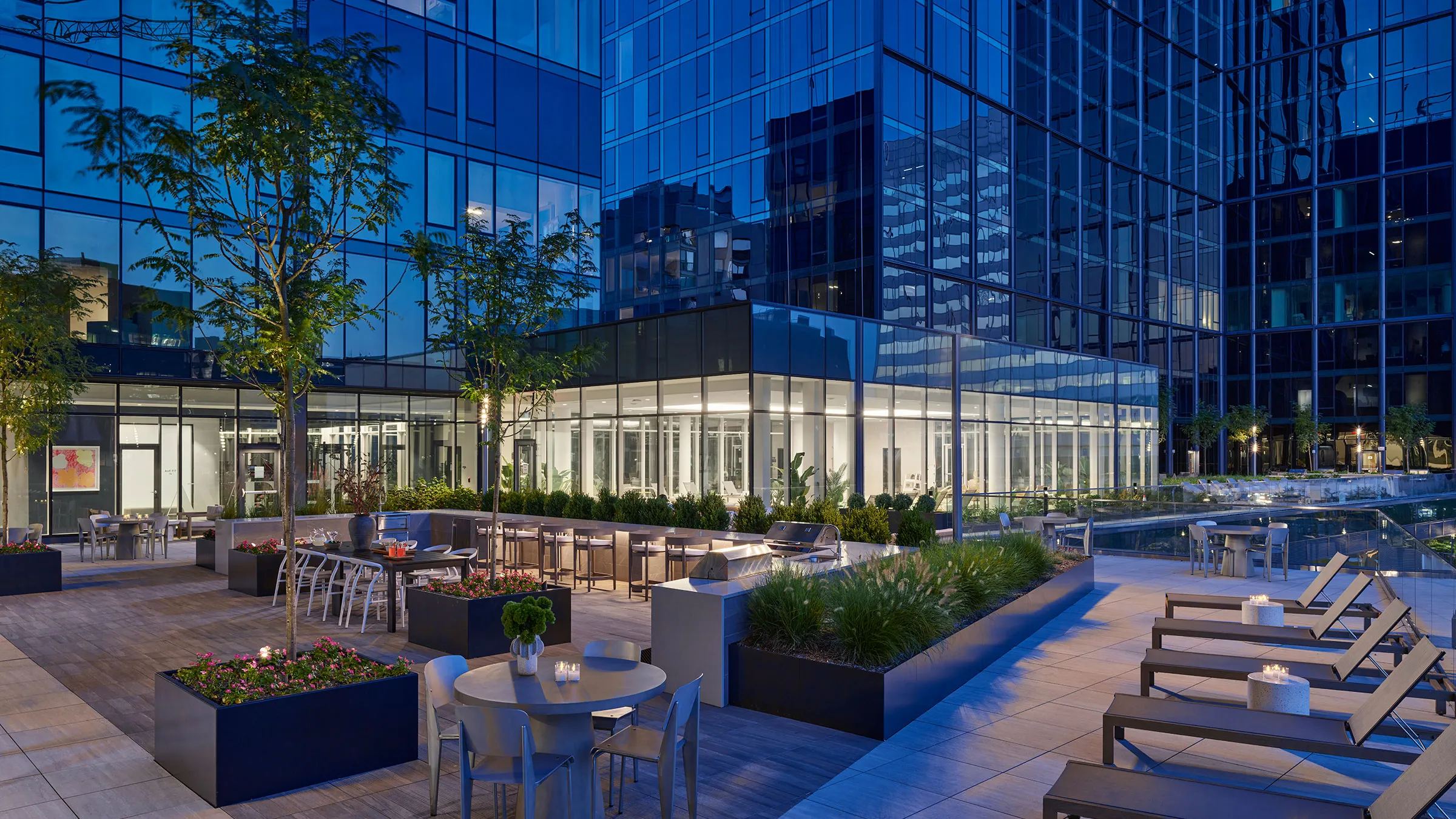 a building with glass walls and tables and chairs