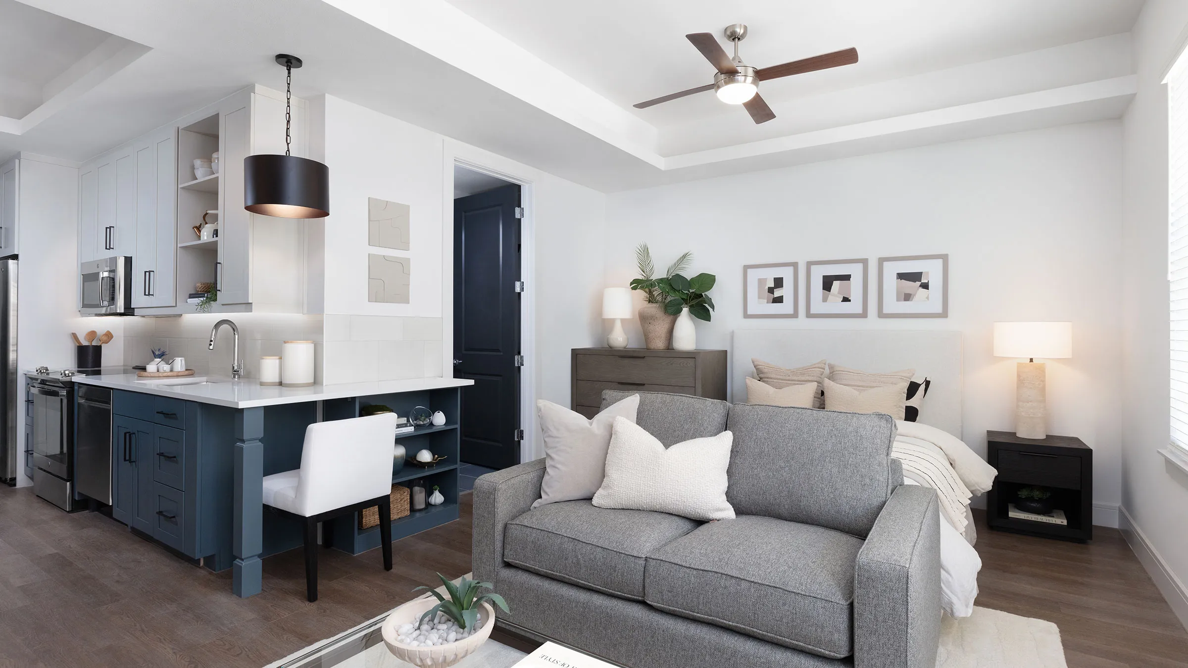 a living room with a couch and a desk