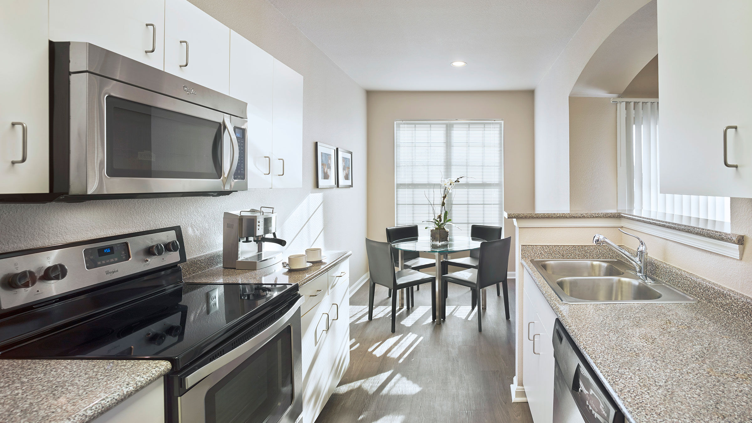 a kitchen with a table and chairs