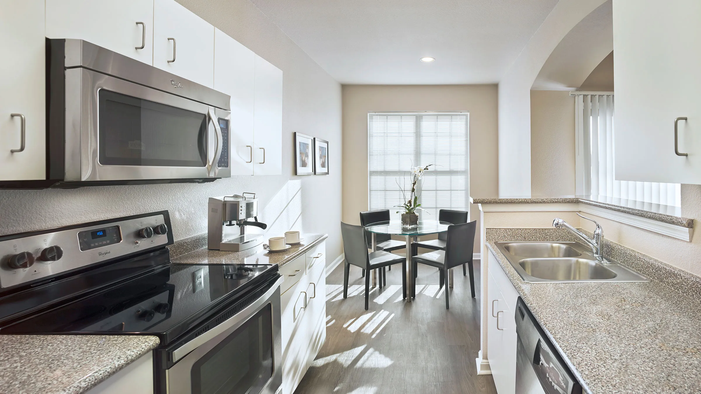 a kitchen with a table and chairs