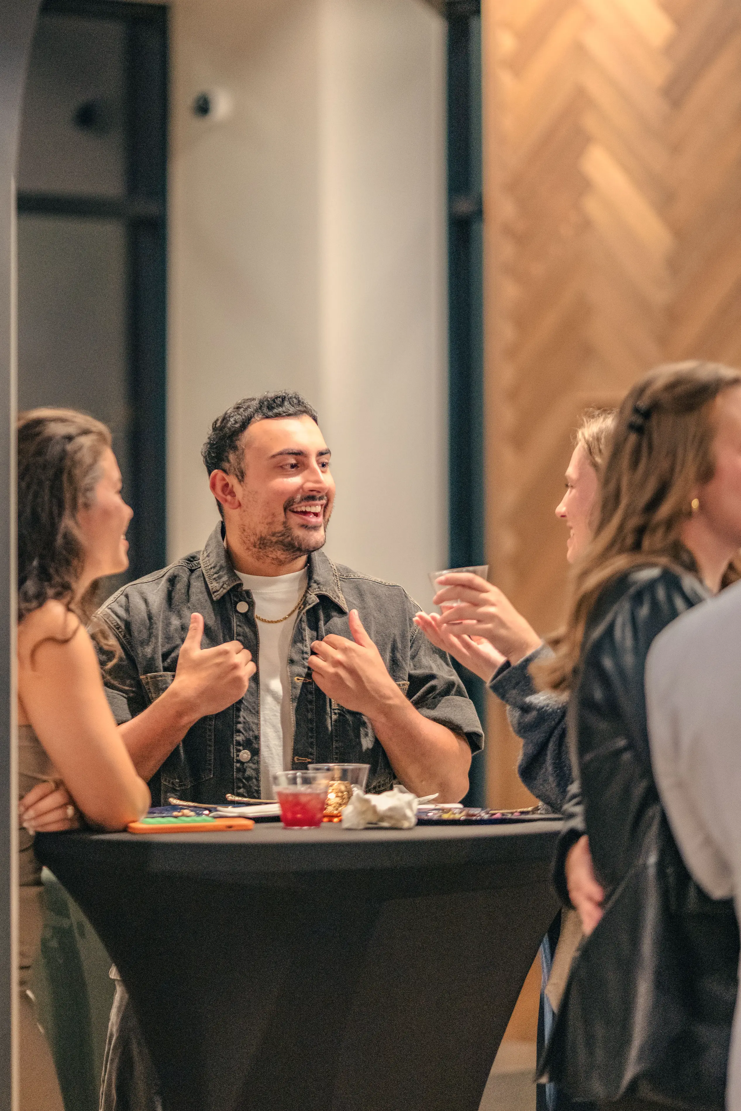 a man sitting at a table with a group of people