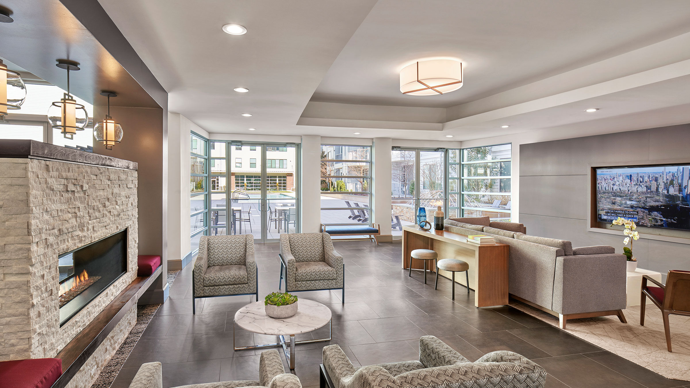 a room with a couch and chairs