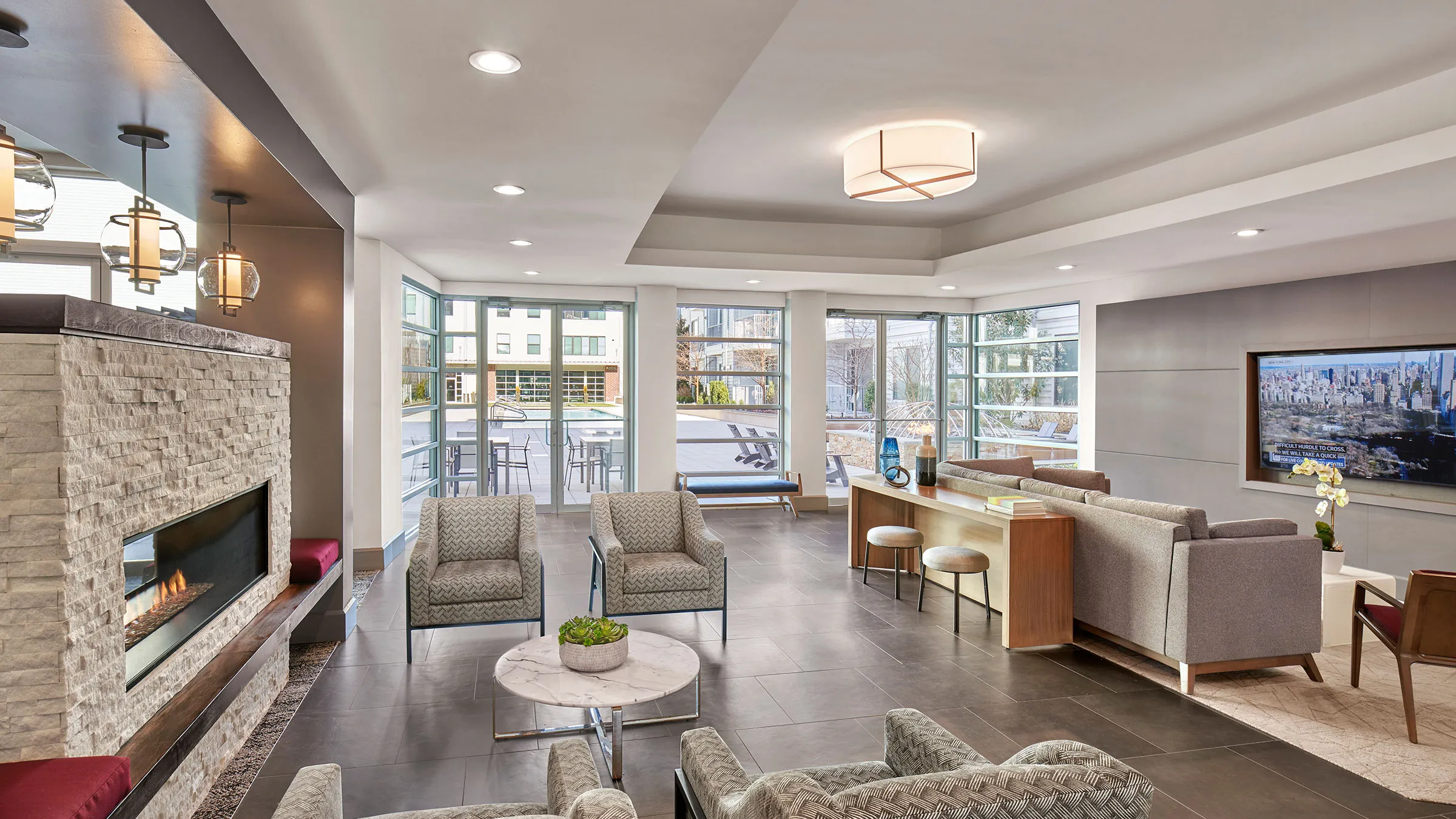 a room with a couch and chairs