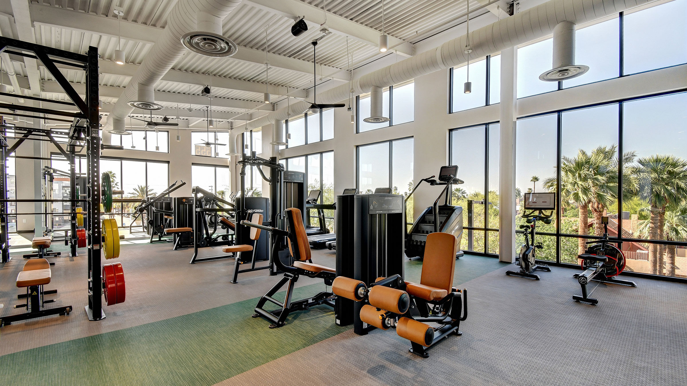 a large room with exercise equipment