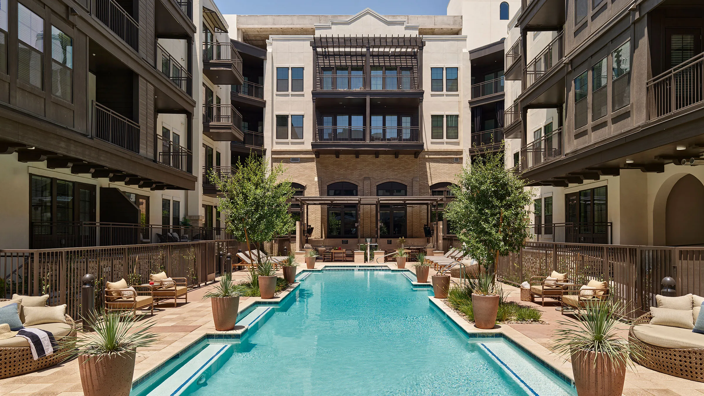 a swimming pool in a courtyard of a building