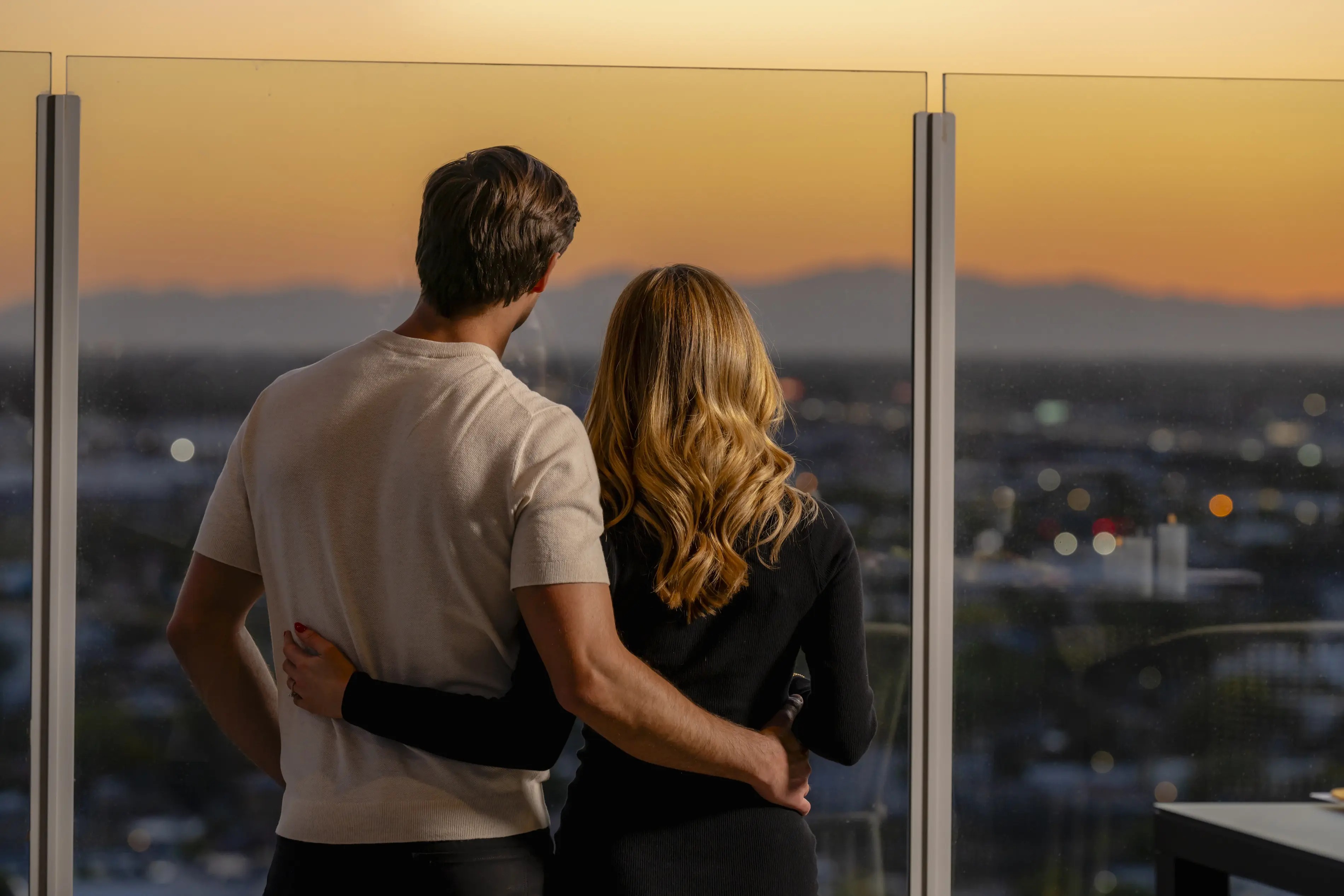 A man and a woman looking out at the Phoenix horizon 