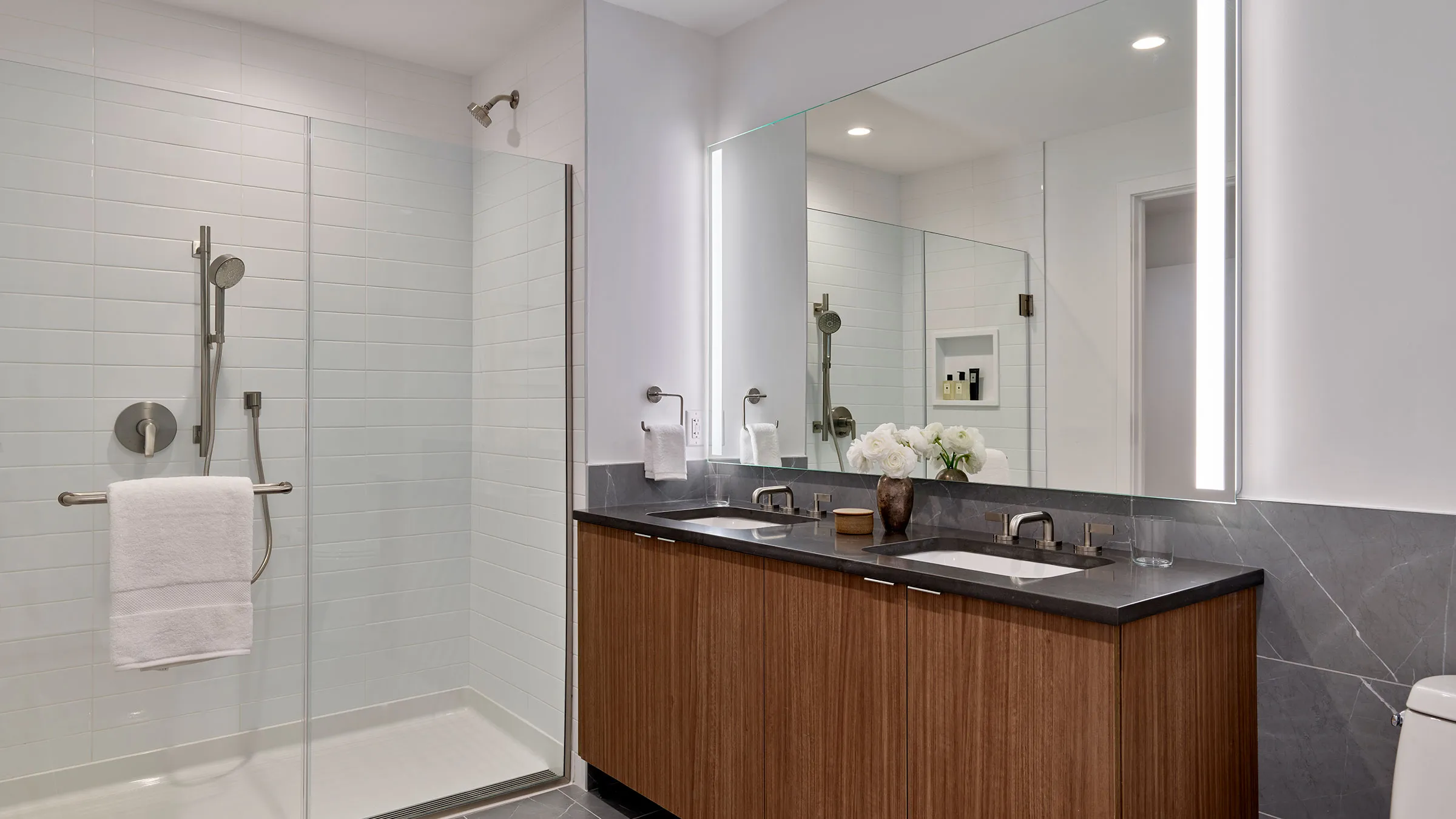 a bathroom with a shower and sink