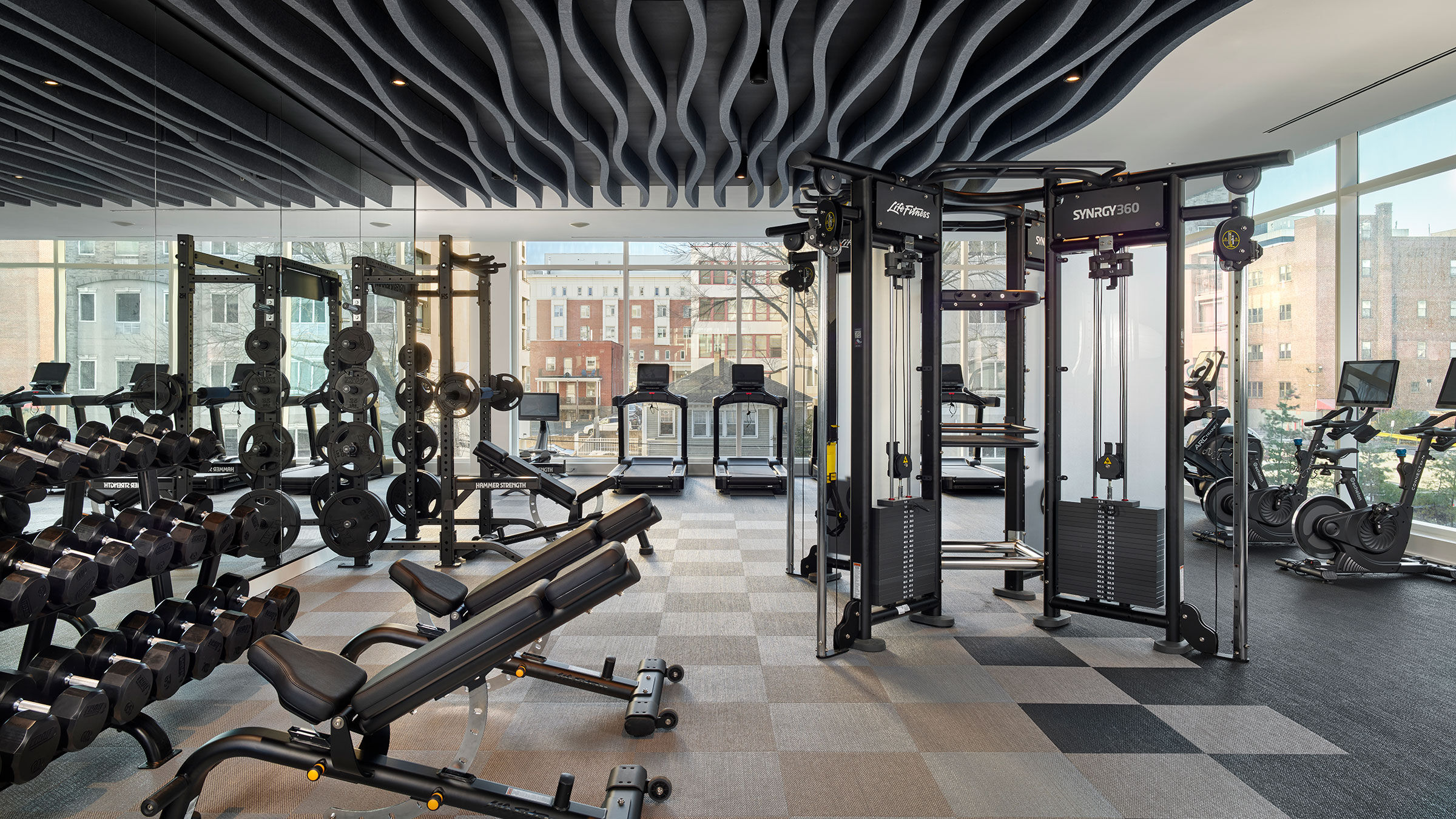 a gym with many exercise equipment