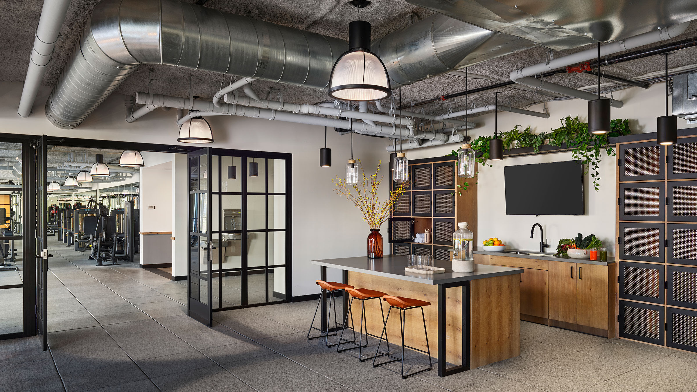 a kitchen with a bar and stools