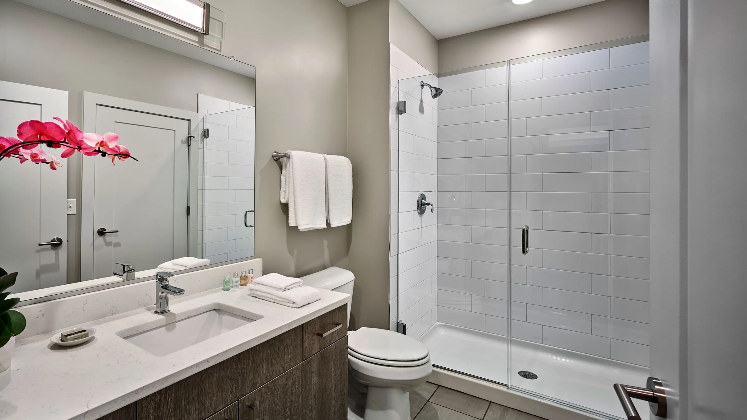 a bathroom with a shower and sink
