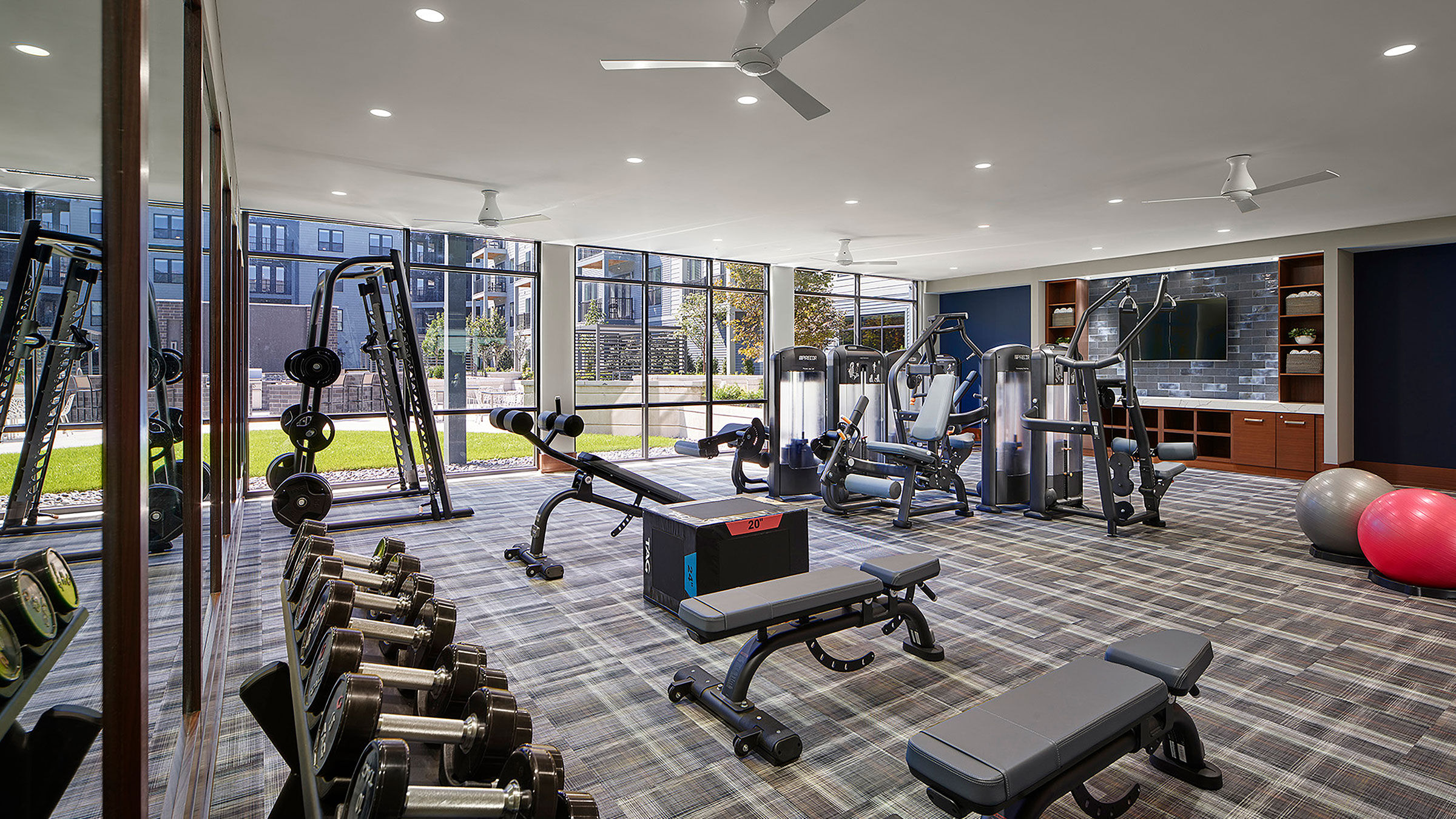 a large room with exercise equipment
