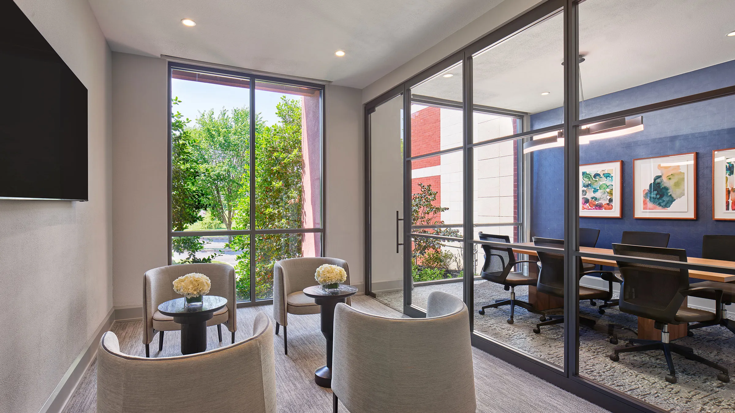 a room with glass walls and chairs