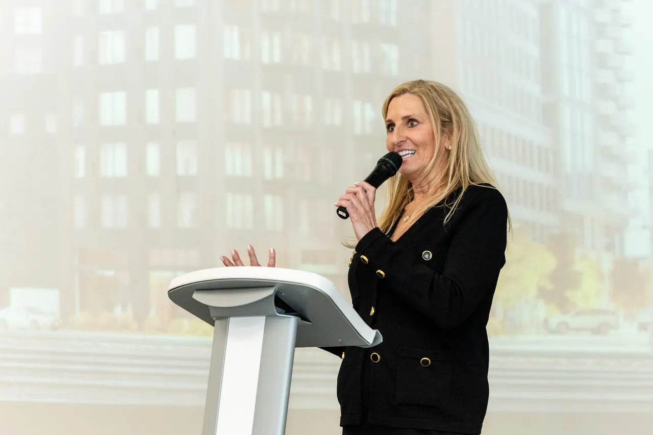 a woman speaking into a microphone