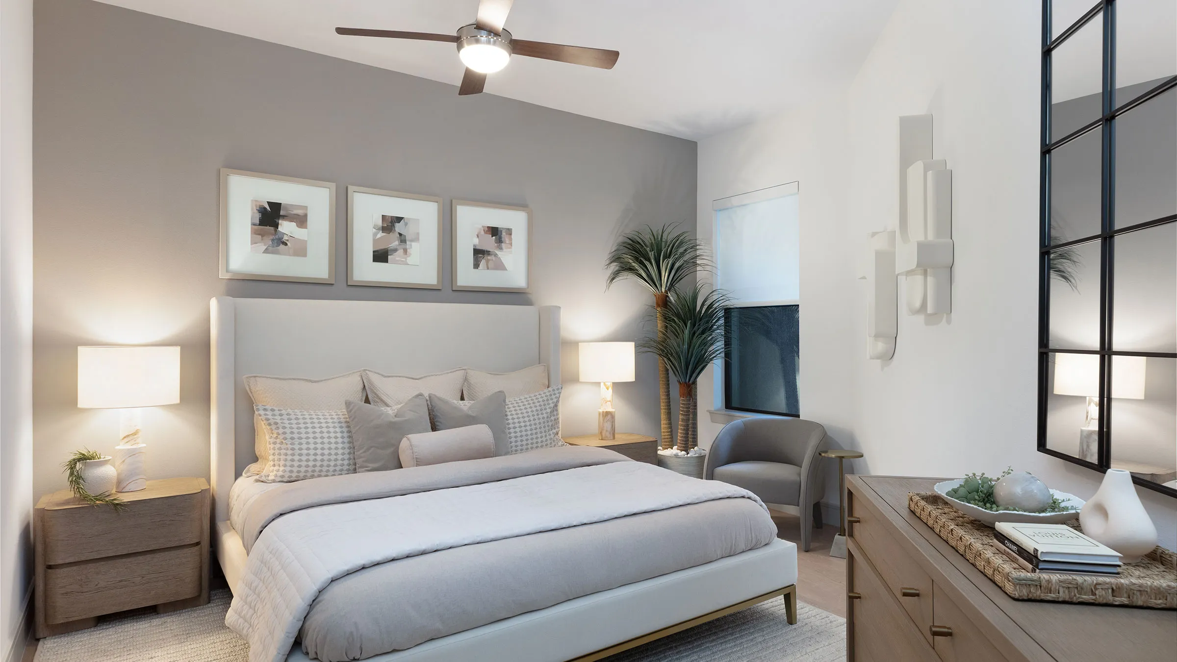 a bedroom with a bed and a fan