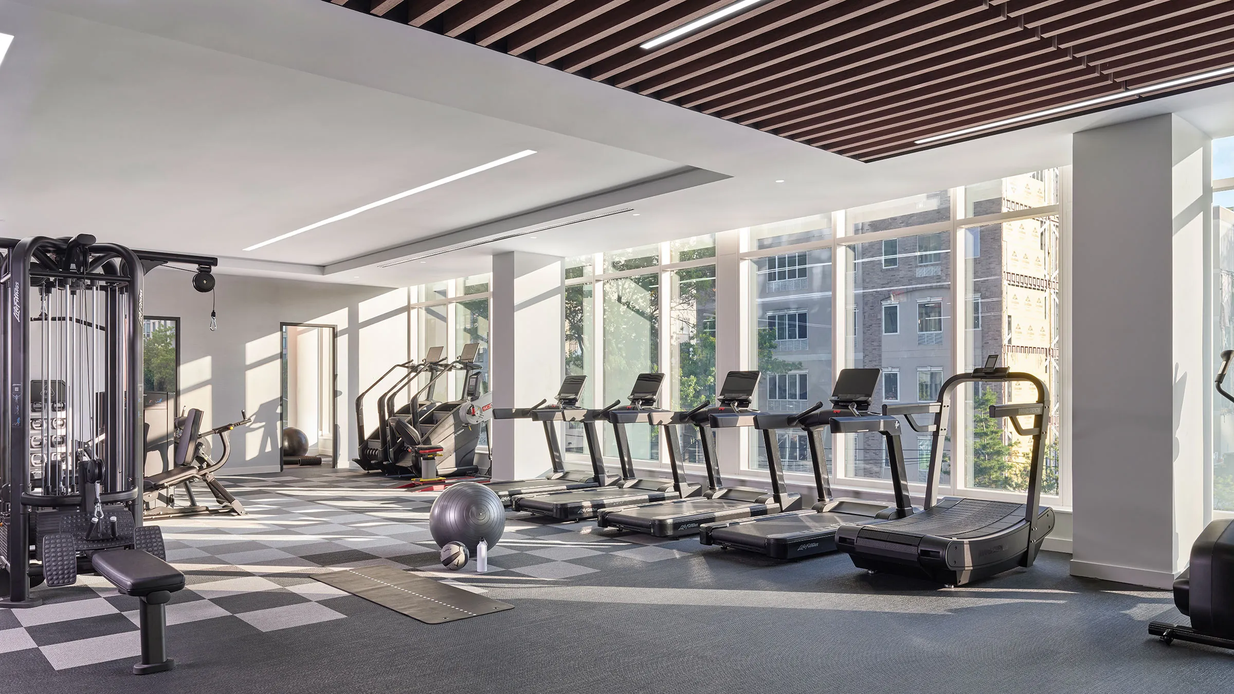 a room with treadmills and exercise equipment