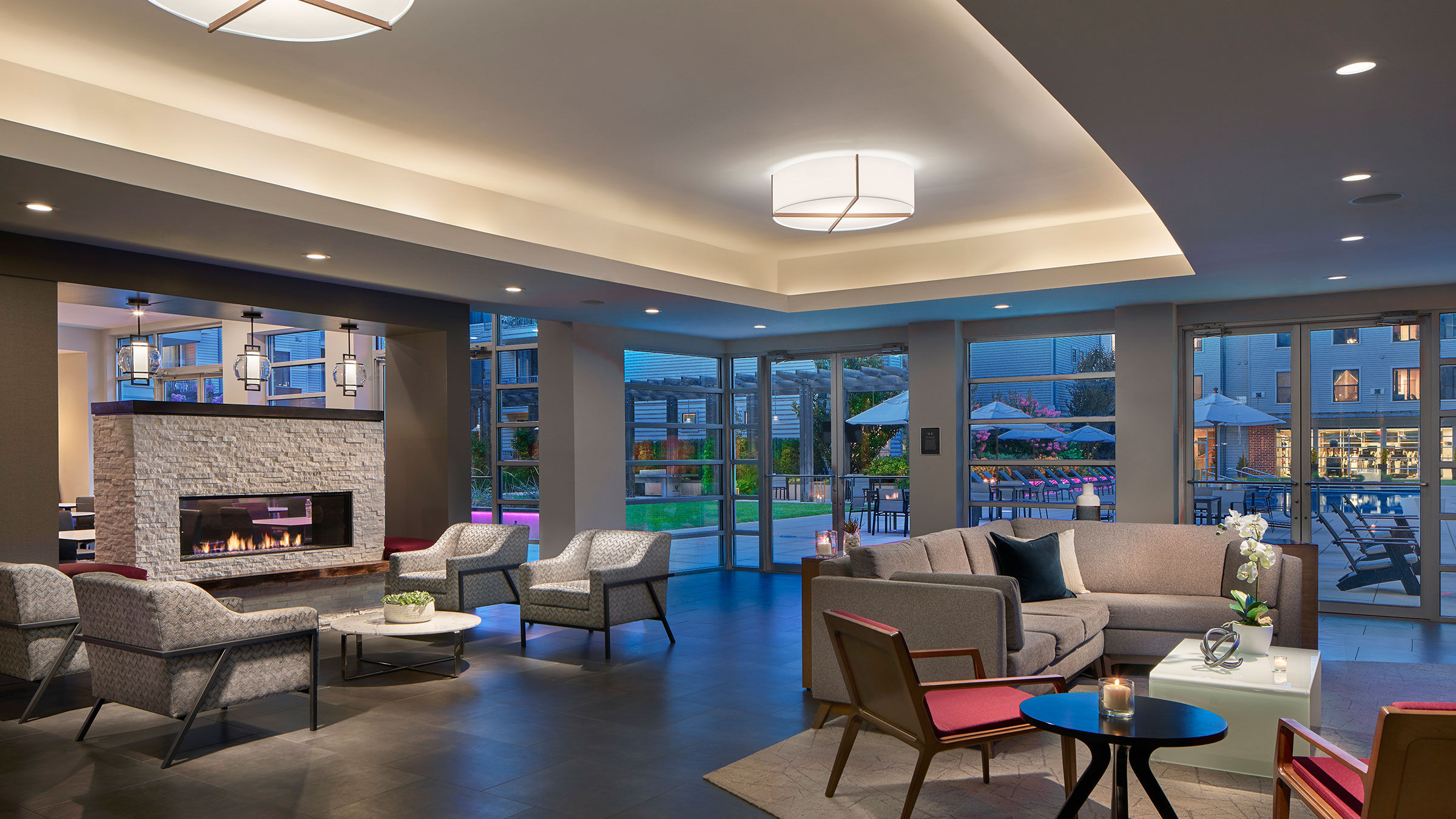 a room with a fireplace and couches