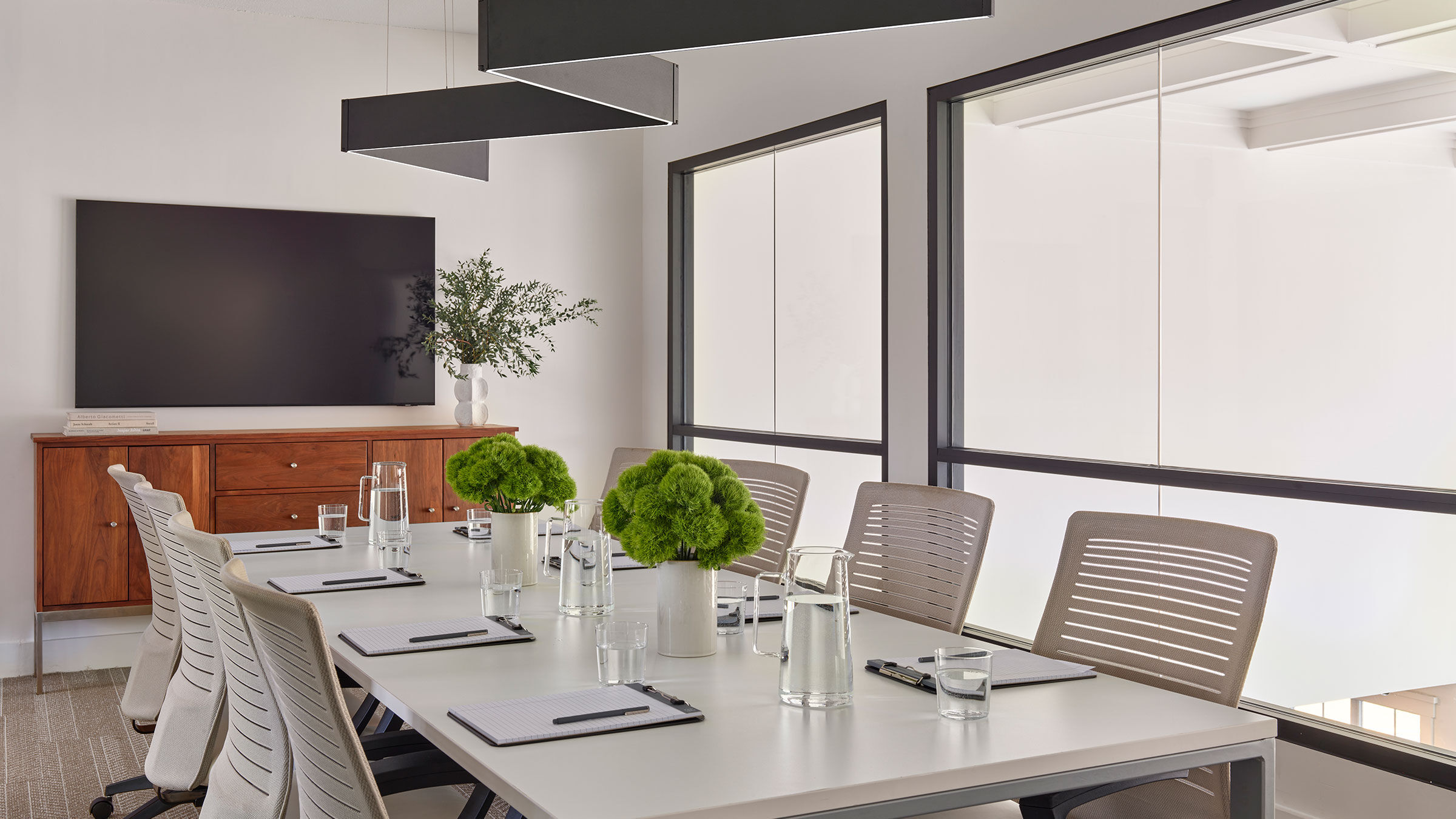 a table with chairs and a tv