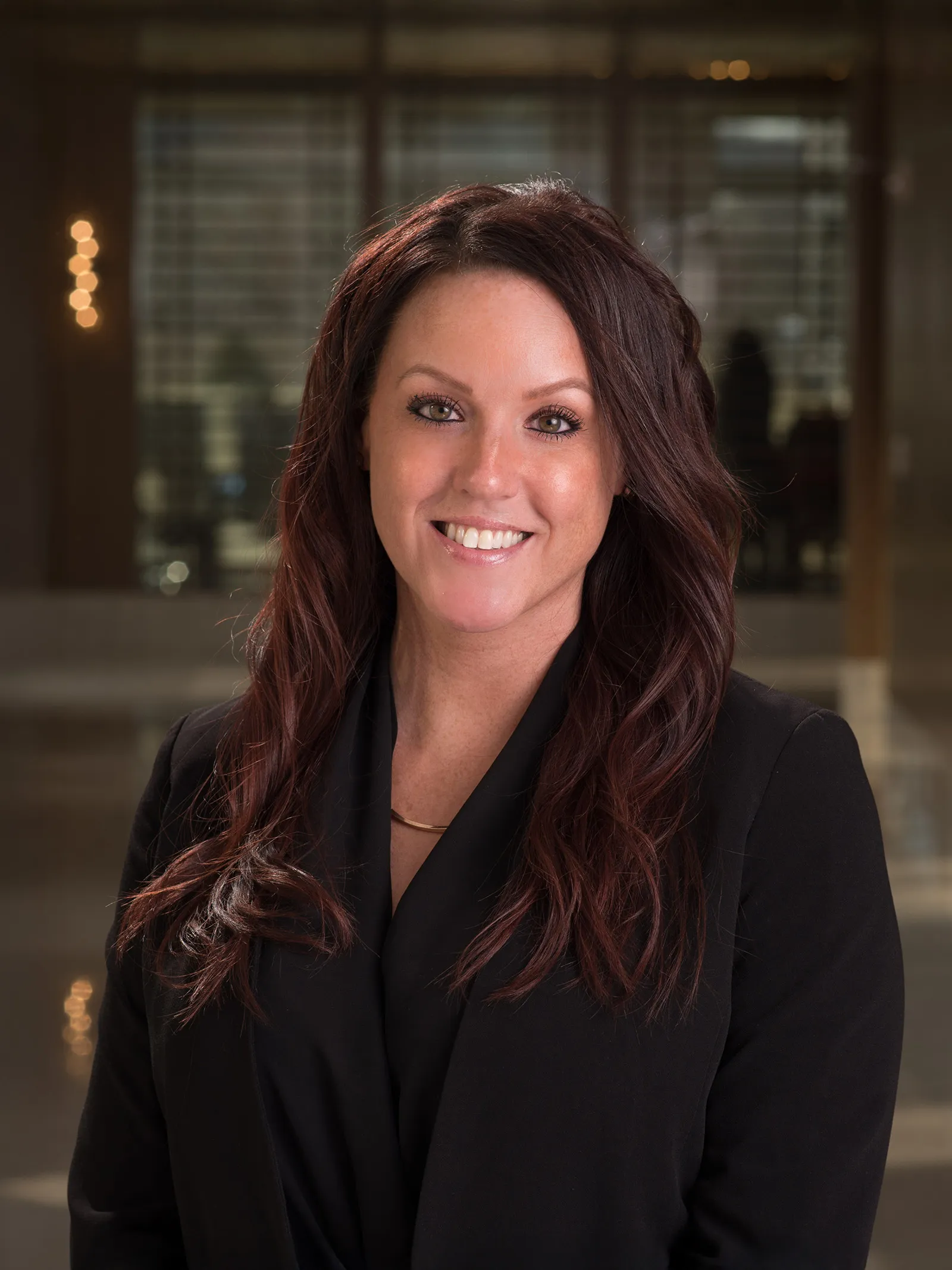 a woman in a black suit